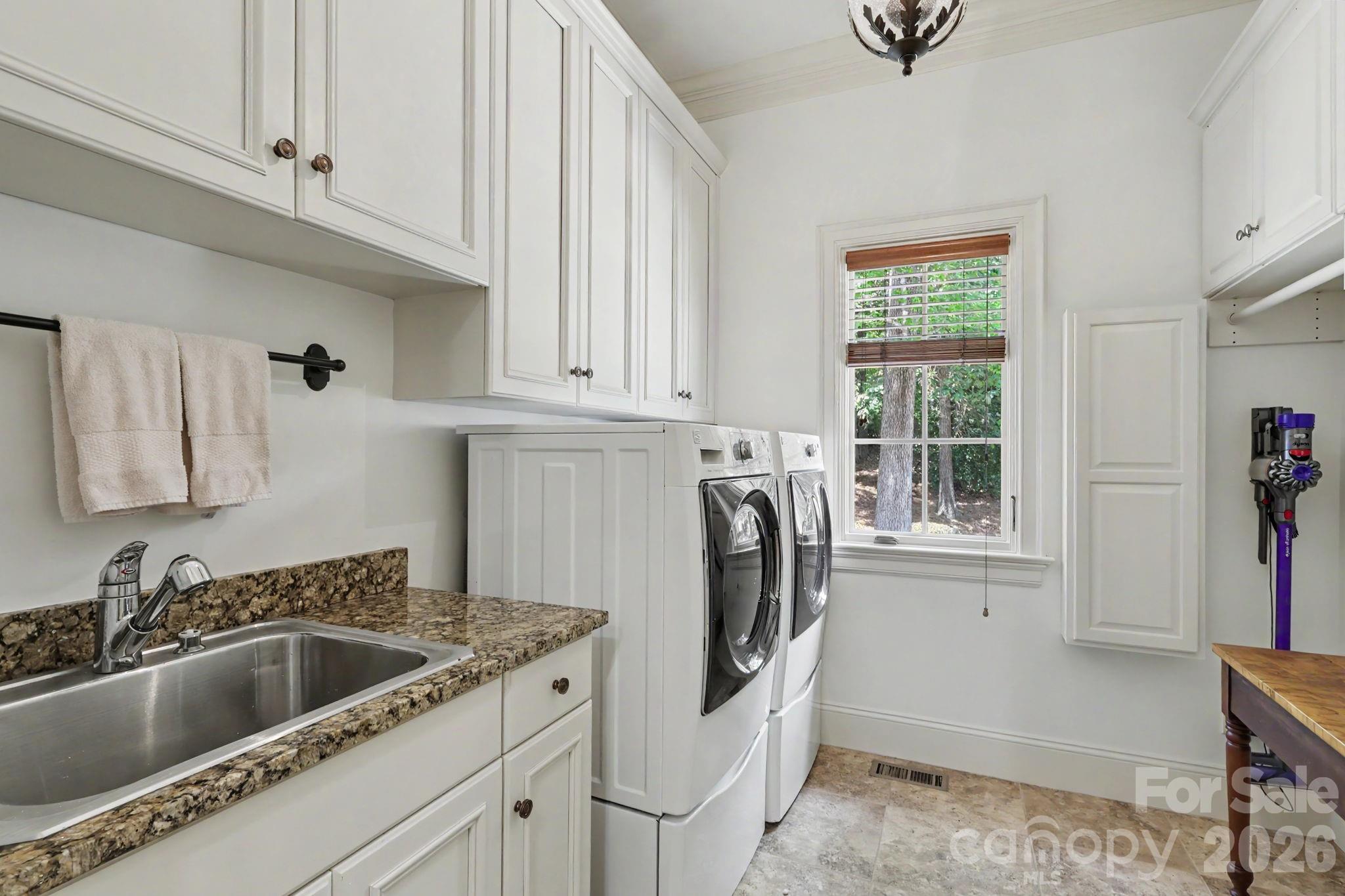 Generous Laundry with iron board, sink and cabinets! - 508 Hideaway Ridge Court, Matthews