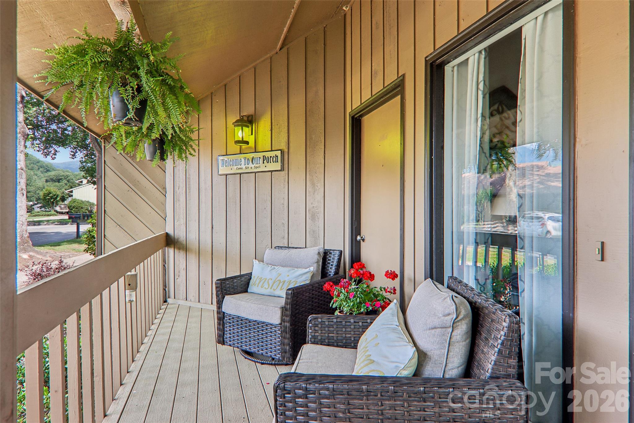 Front covered porch looking at the mountians - 147 W Lake Drive S, Lake Lure