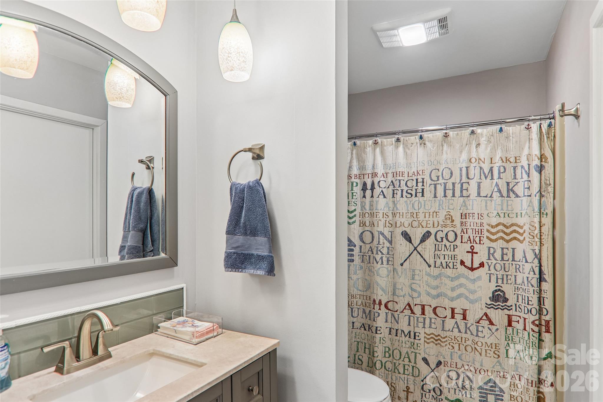 Updated bathrooms with new fixtures - 147 W Lake Drive S, Lake Lure