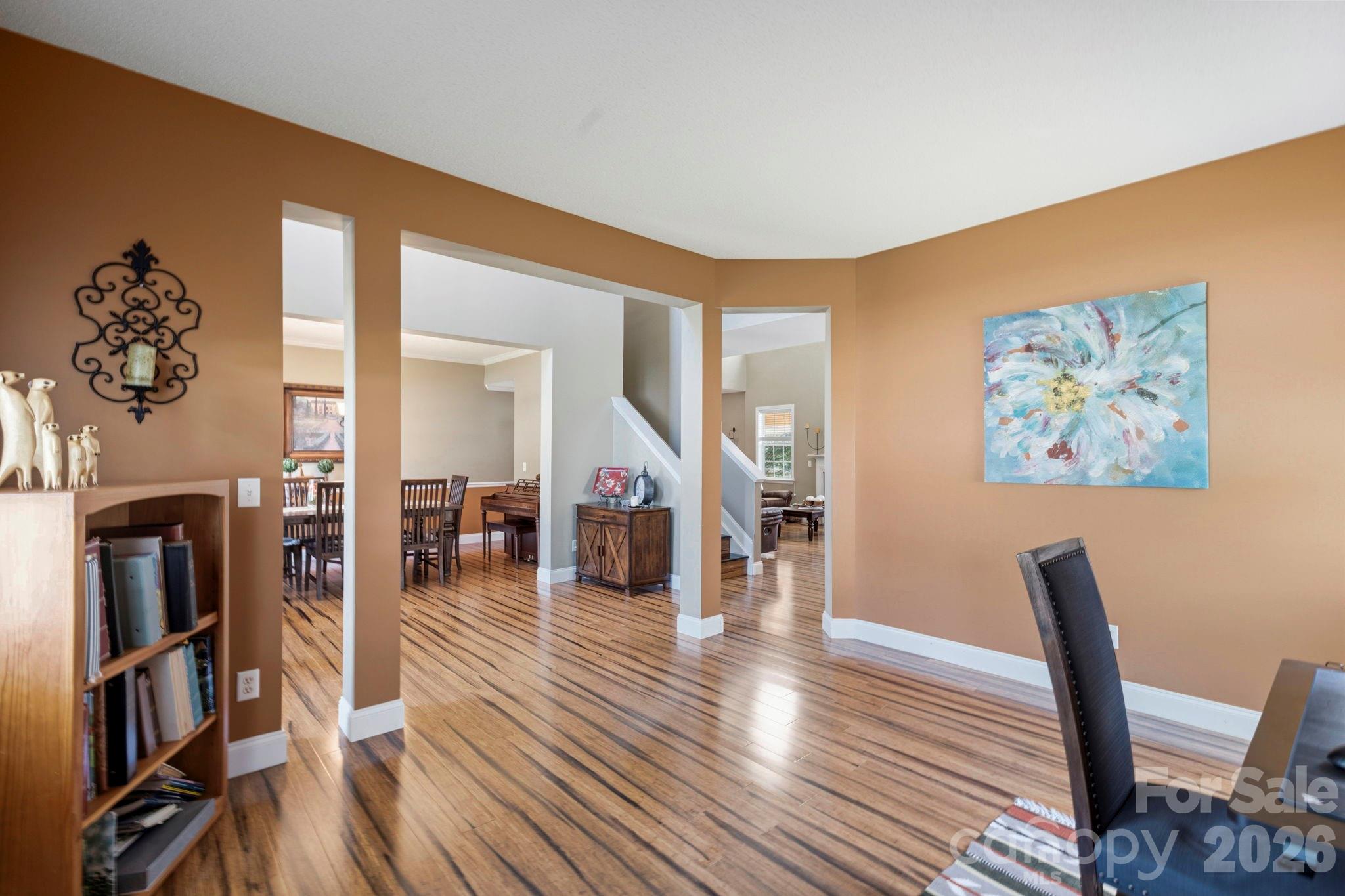 View from the office showcasing the flowing floor plan, high ceilings, and seamless connection between living spaces. - 266 Wildbriar Road, Fletcher