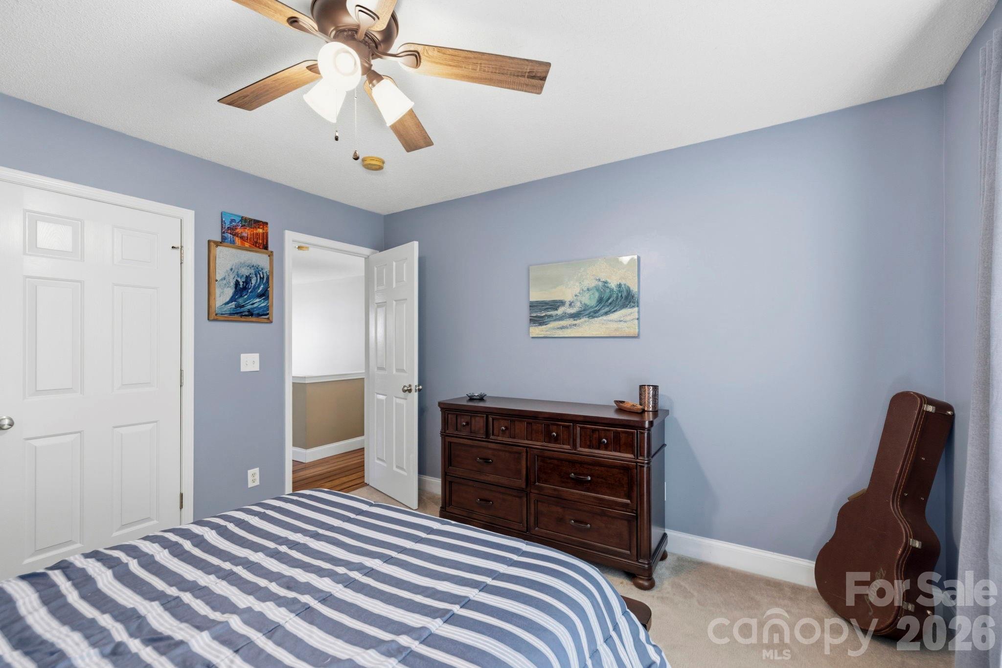 Inviting secondary bedroom offering ample floor space, large closet, and versatile use for family, guests, or a home office. - 266 Wildbriar Road, Fletcher