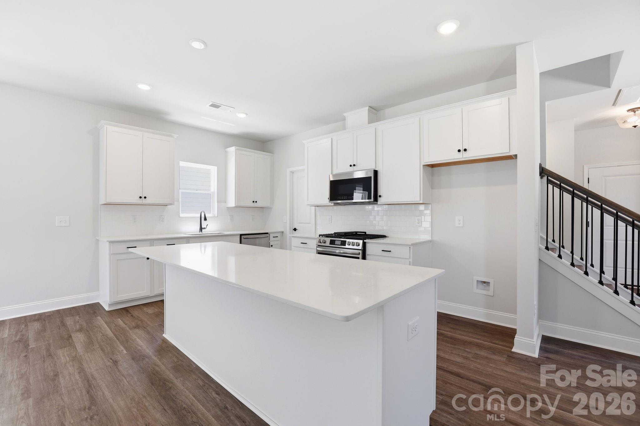 Kitchen with quartz cc, gas range, large island, walk in pantry - 4009 Grommet Court, Matthews