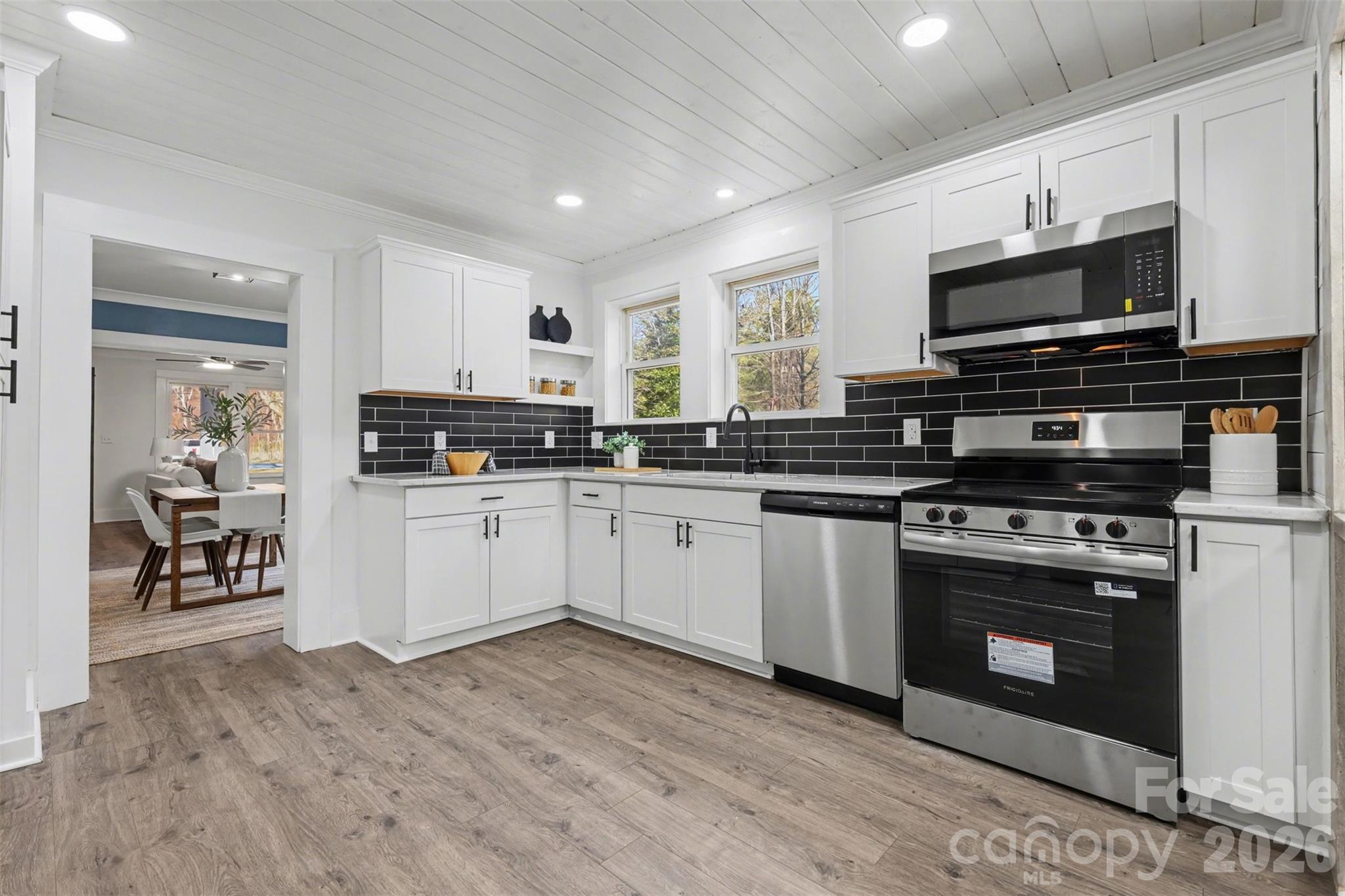New stainless steel range, DW and microwave, recessed lighting, and beautiful tongue and gorrove ceilings - 622 Neelys Creek Road, Rock Hill