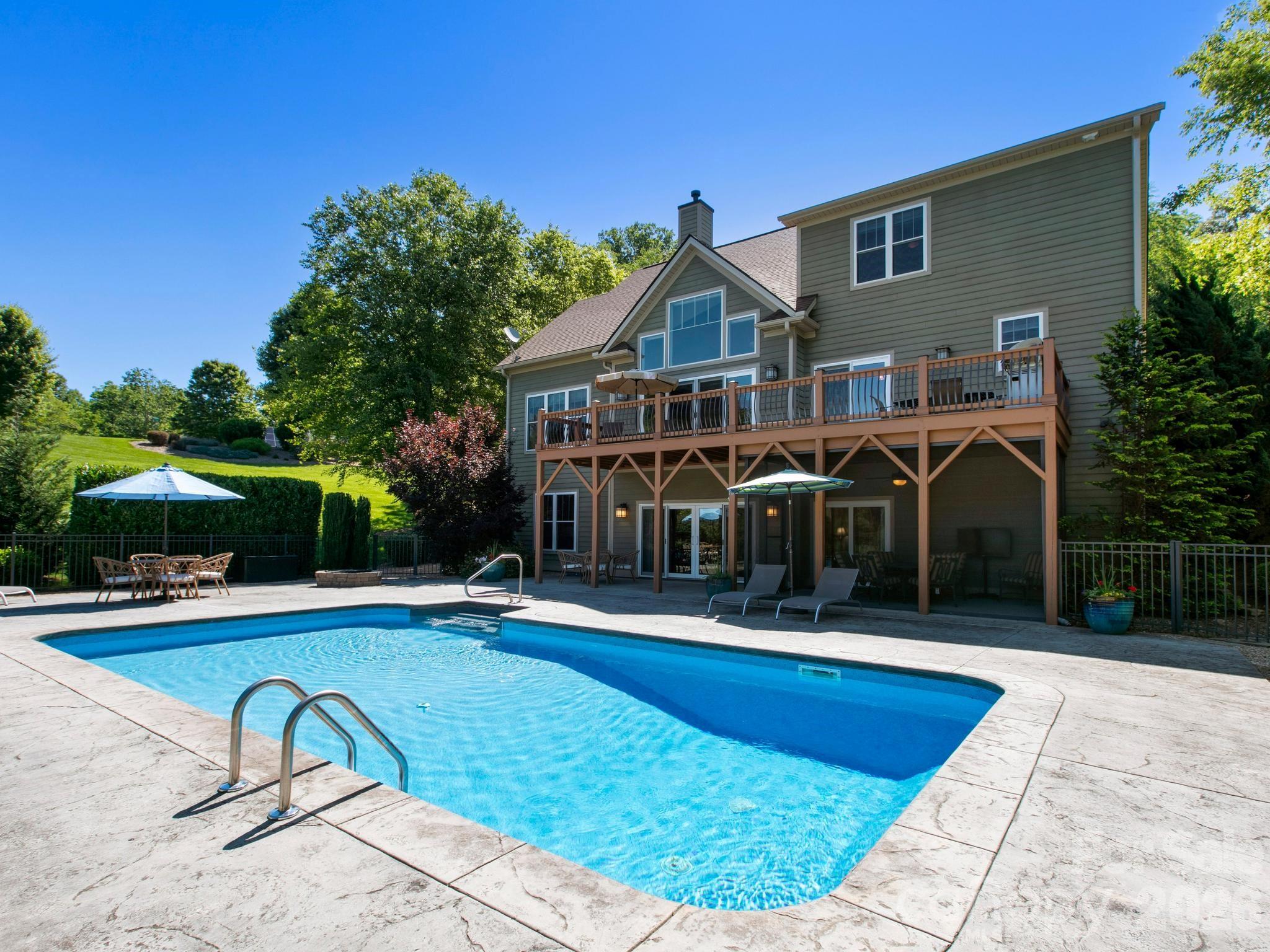 View of the home from the pool - 32 Lake Vista Drive, Fletcher