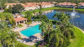 Community Pool overlooking lake - 3662 PARKRIDGE CIR #28-102, SARASOTA