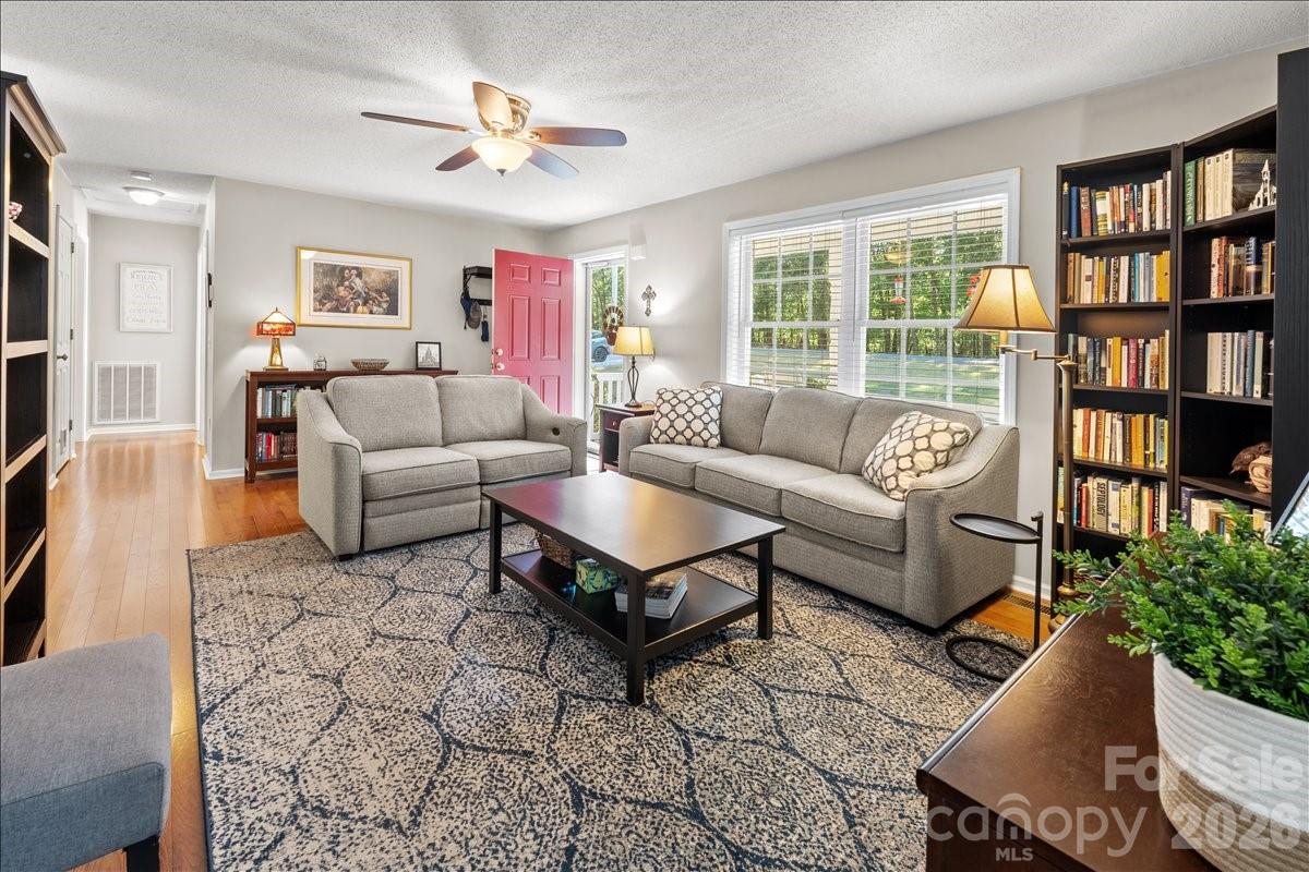Another view of the living room.  The storm door and windows provide nice light in this space. - 104 Balsam Circle, Troy