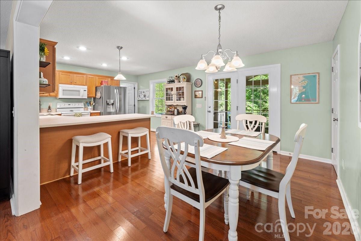 Well maintained hardwood flooring throughout the living room, dining area and kitchen. - 104 Balsam Circle, Troy