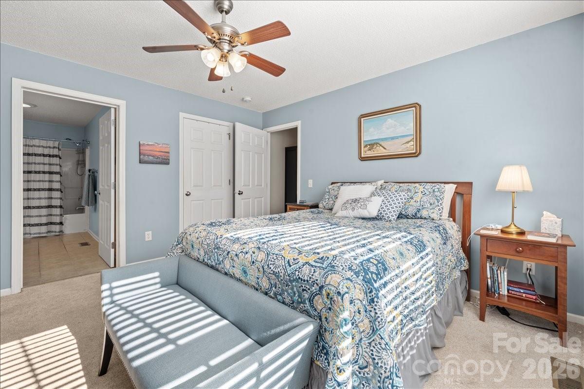 Another view of the primary bedroom with the primary bath. - 104 Balsam Circle, Troy