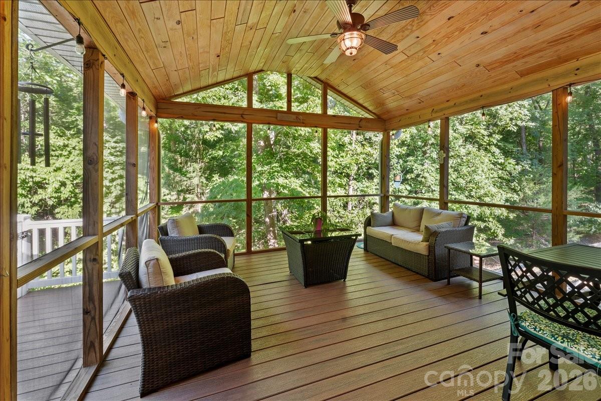 Wooded views give a treehouse feel to the porch. - 104 Balsam Circle, Troy