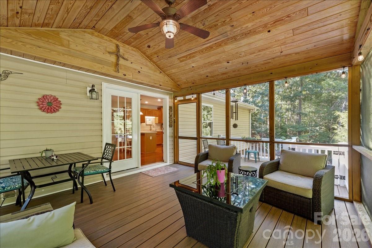 A Ceiling fan, fire table and cozy lighting make this a 3 season extension of living space for an owner to enjoy. - 104 Balsam Circle, Troy