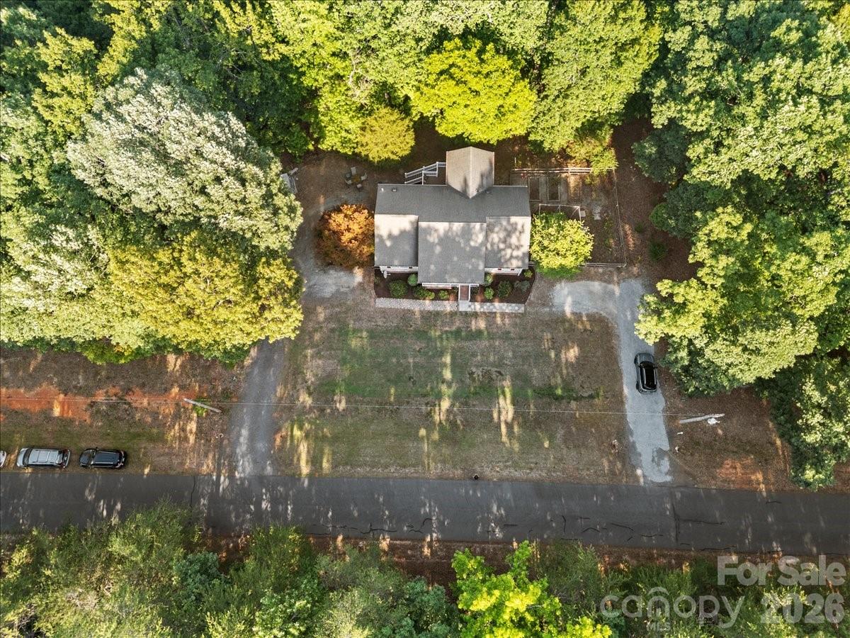 Driveway parking to the right and drive around driveway to the back of the property on the left. - 104 Balsam Circle, Troy
