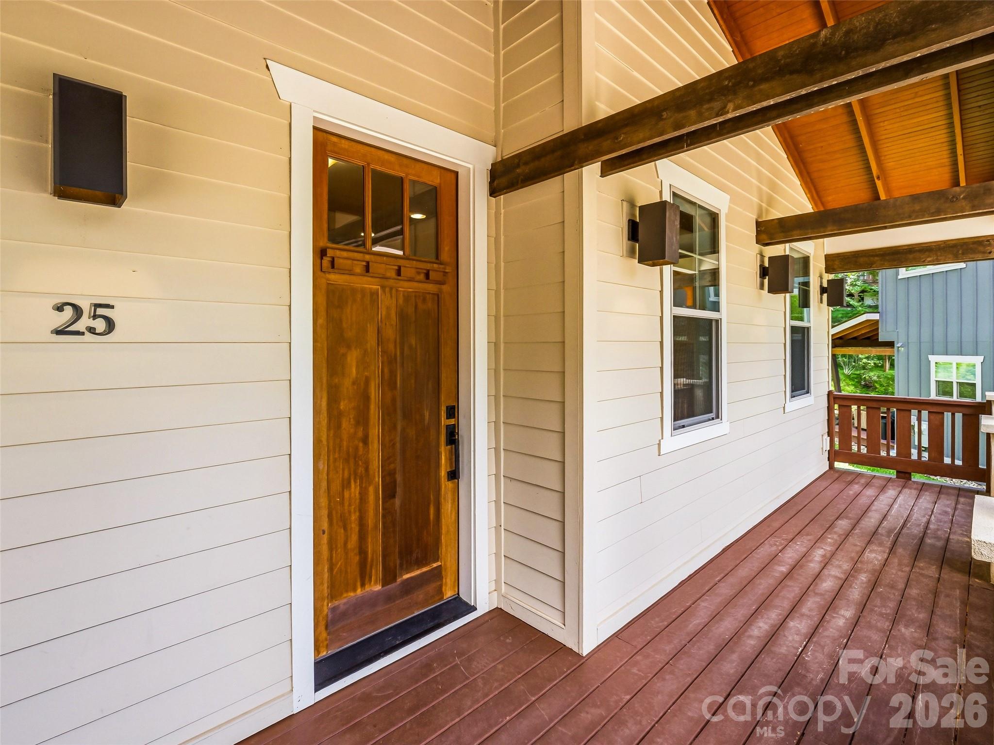 Inviting front entry with premium fiber-cement and cedar shake exterior siding. - 25 Shady Park Lane, Asheville