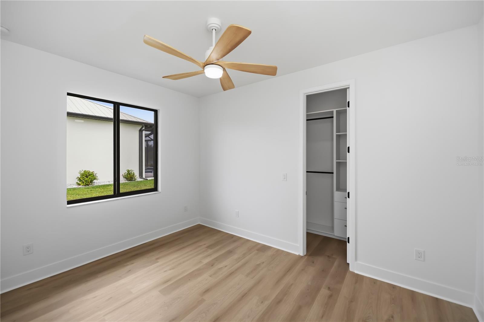 Virtually Staged Third Bedroom with Walk-In Closet. - 16692 LIGGETT CIR, PORT CHARLOTTE