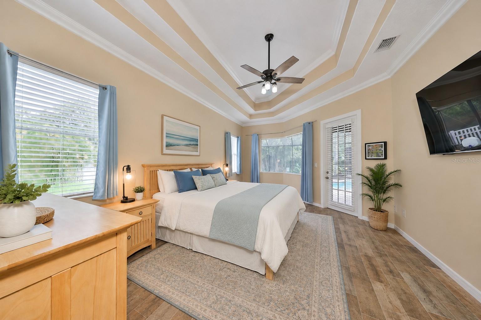 vitually staged Main home owner's suite with door to Pool area - 17706 BRIDLEWOOD CT, PARRISH