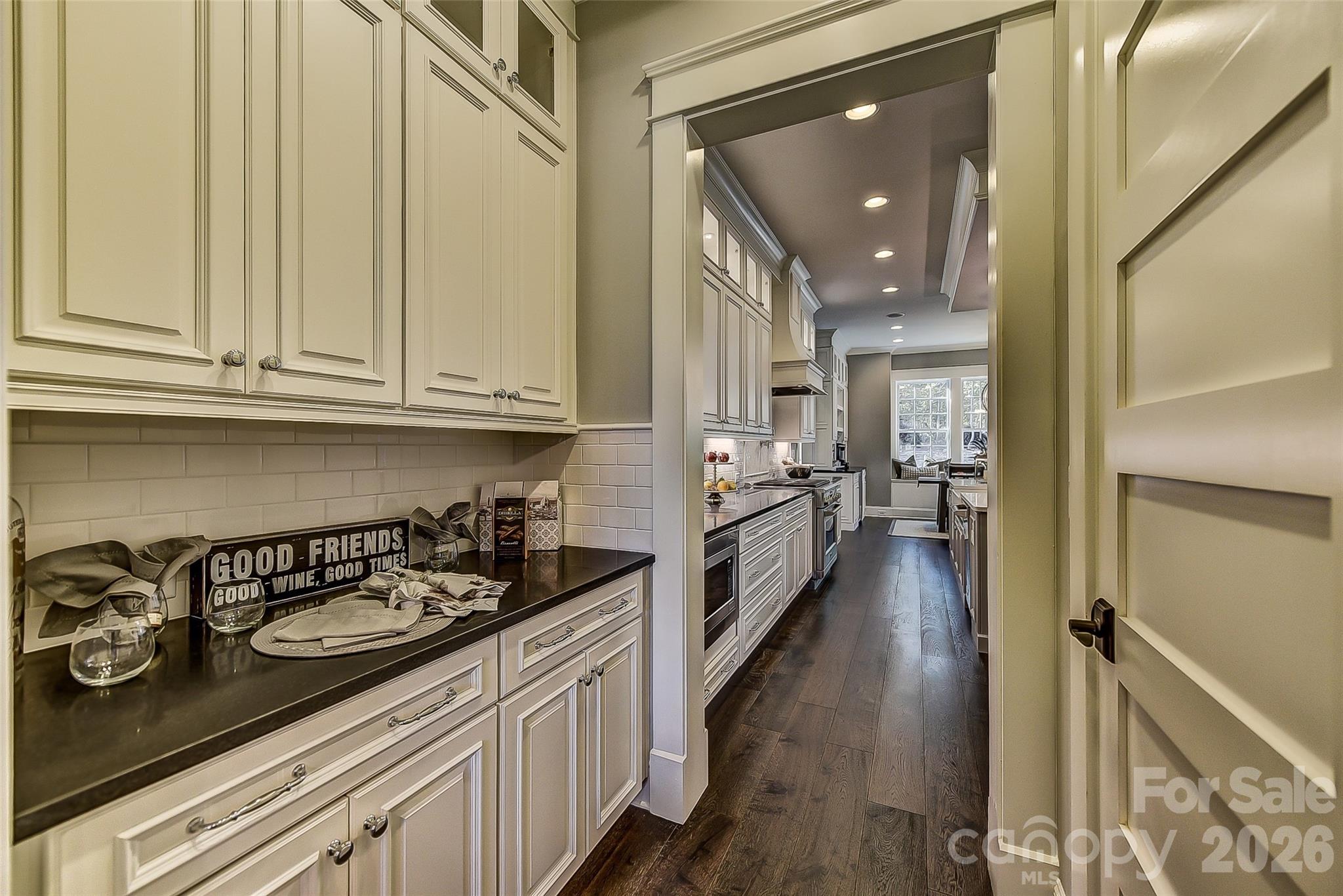 Representative PhotoButler's pantry with added cabinets and adjacent large closed pantry - 752 Lynderhill Lane, Matthews