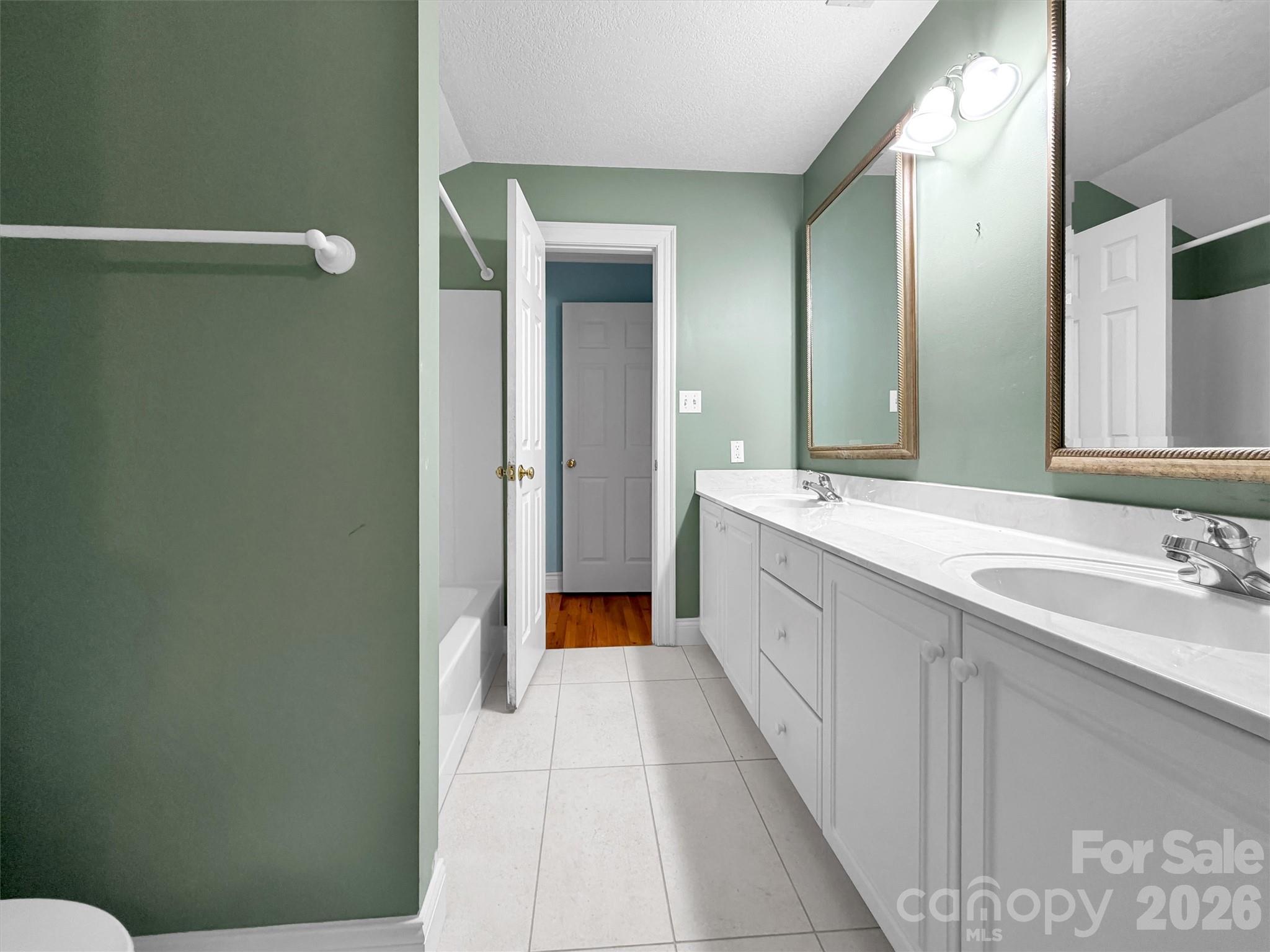 Second bath/ upstairs. Jack and Jill style. Brand new floor tile - 9 Hickory Ridge, Fletcher