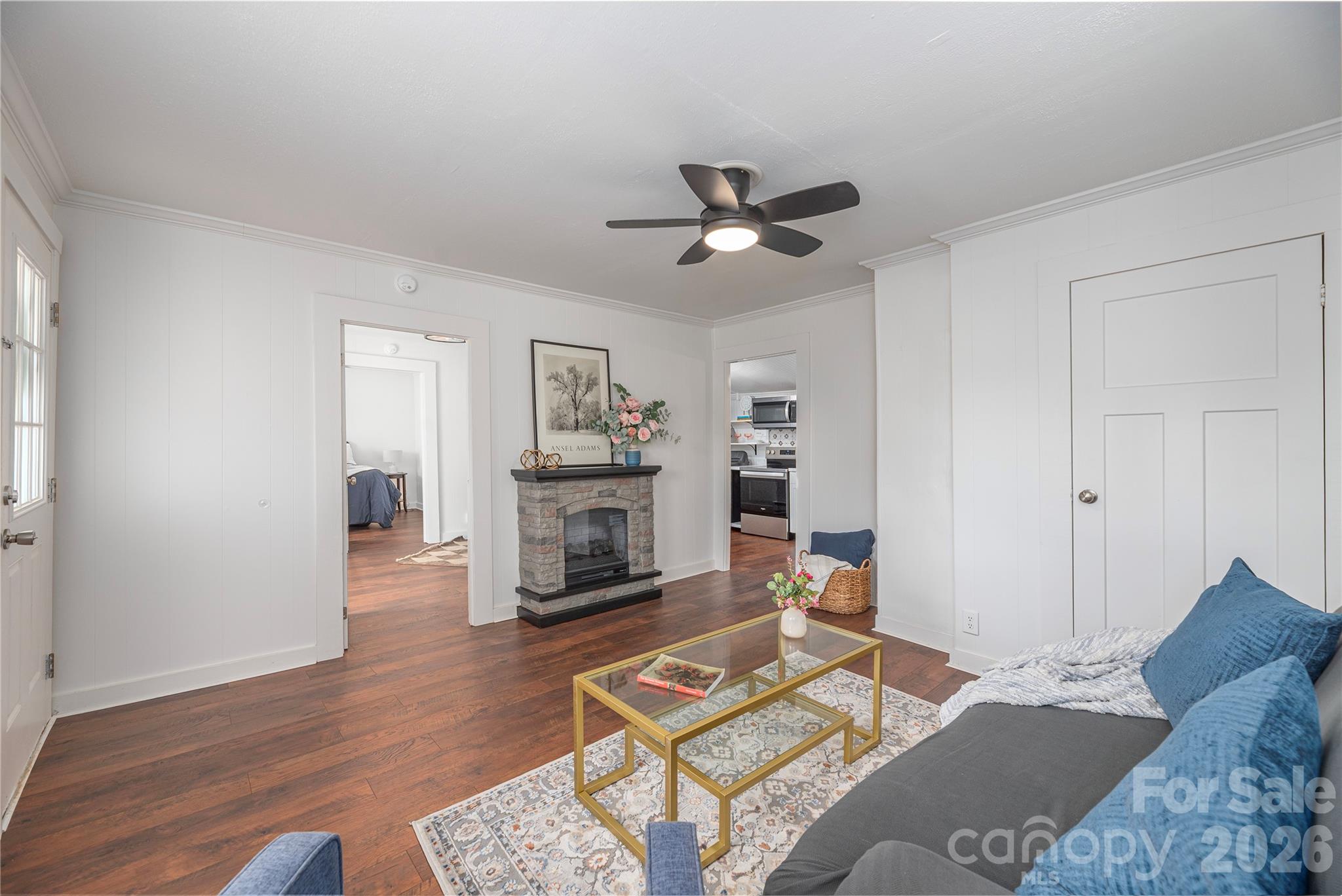 Inviting living room featuring an electric fireplace and updated finishes. - 261 Star Ridge Road, Canton