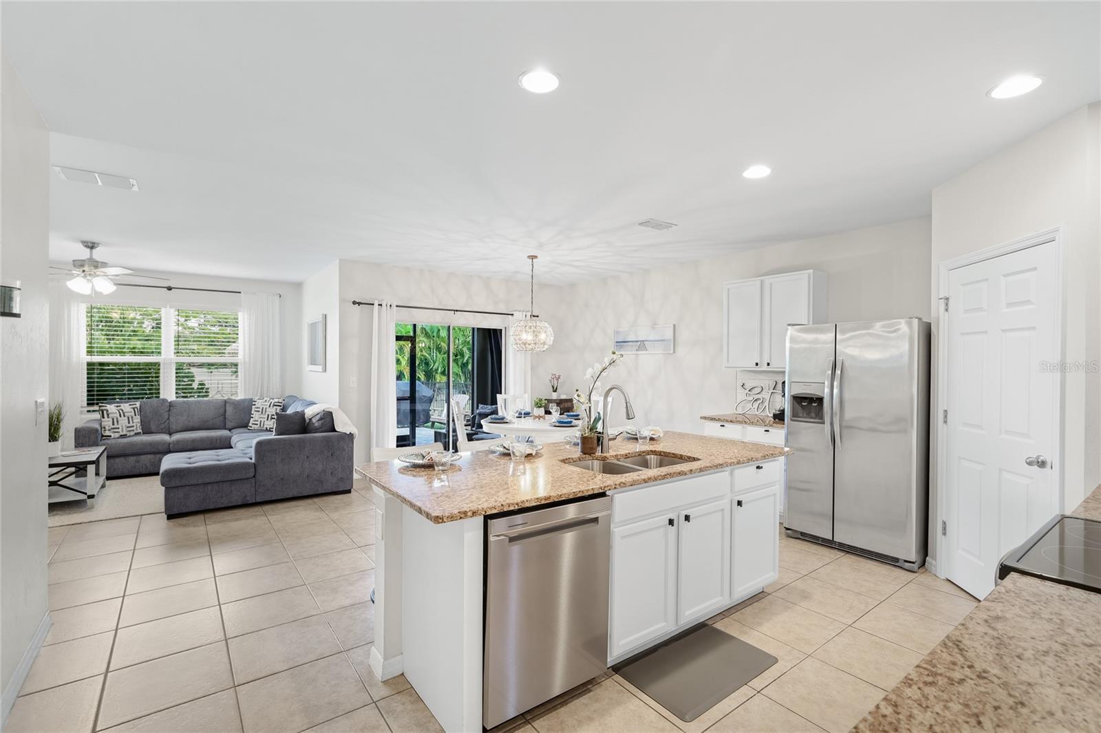 Open concept Kitchen, Eat in Kitchen and Family Room. - 24413 BANDONI PL, VENICE