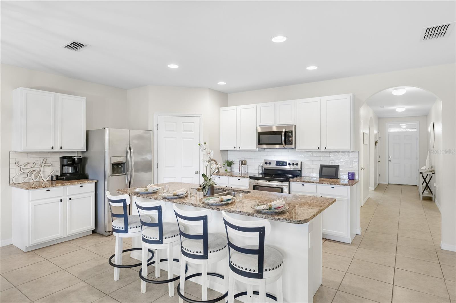 Large Kitchen with Grande Island and abundant seating space for functional living and entertaining. - 24413 BANDONI PL, VENICE