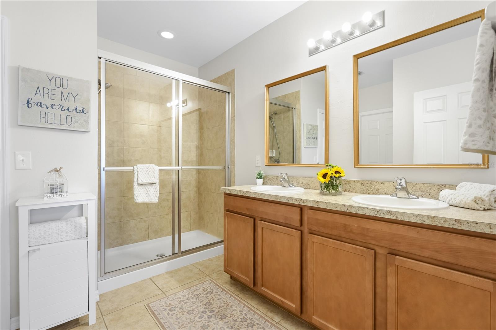 En-suite Bathroom with walk in shower and two walk-in closets. - 24413 BANDONI PL, VENICE
