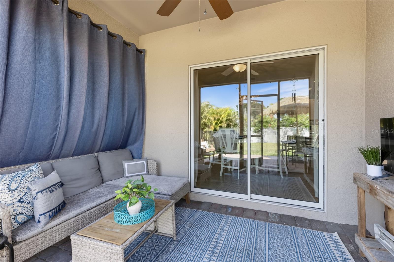 Sliders off Kitchen to Lani with new screens, outdoor light and Fan and set-up for a TV. - 24413 BANDONI PL, VENICE
