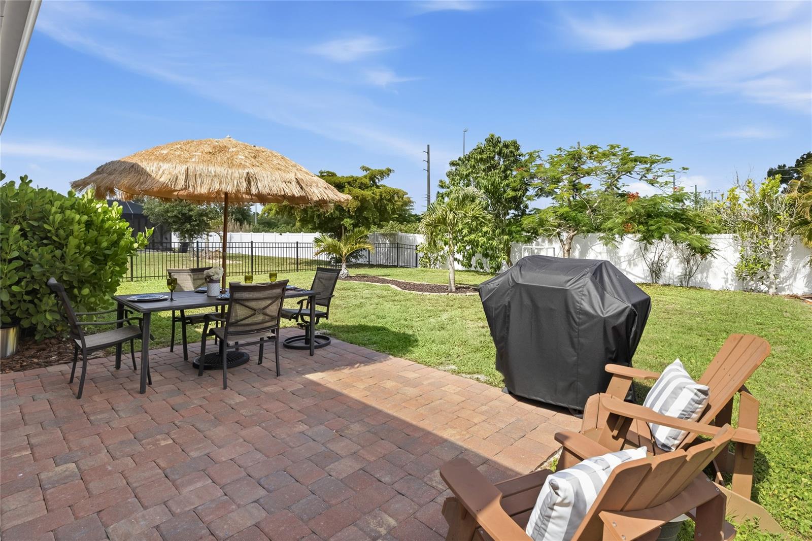 Paver Patio off the Lanai to extend the functional outdoor apace and a large complete fenced in yard. - 24413 BANDONI PL, VENICE