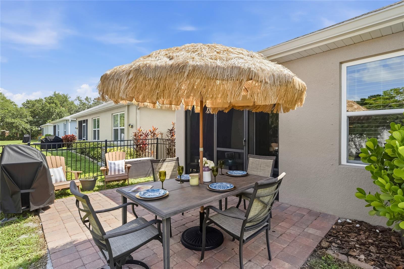 Paver Patio off the Lanai to extend the functional outdoor apace and a large complete fenced in yard. - 24413 BANDONI PL, VENICE