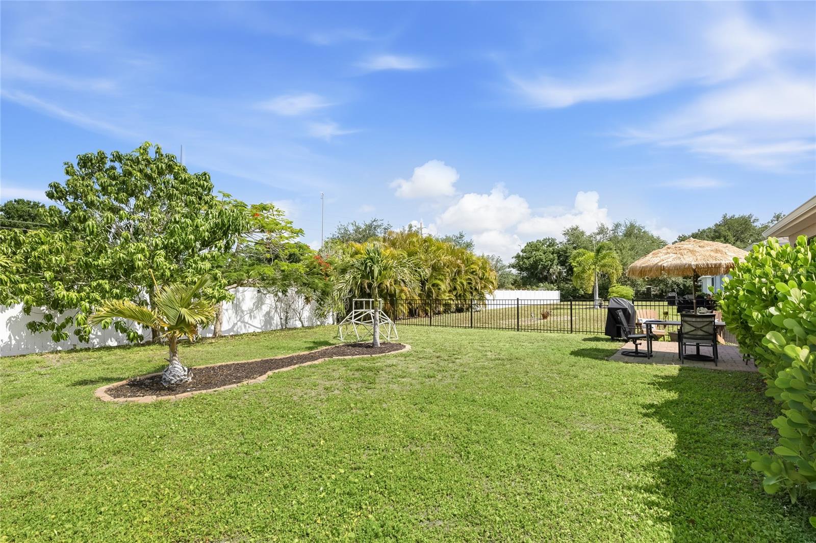 Paver Patio off the Lanai to extend the functional outdoor apace and a large complete fenced in yard. - 24413 BANDONI PL, VENICE