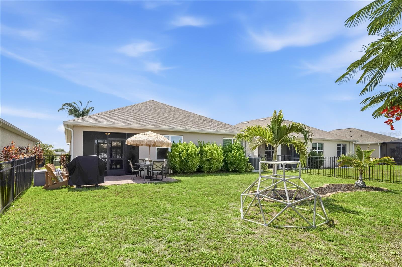 Paver Patio off the Lanai to extend the functional outdoor apace and a large complete fenced in yard. - 24413 BANDONI PL, VENICE
