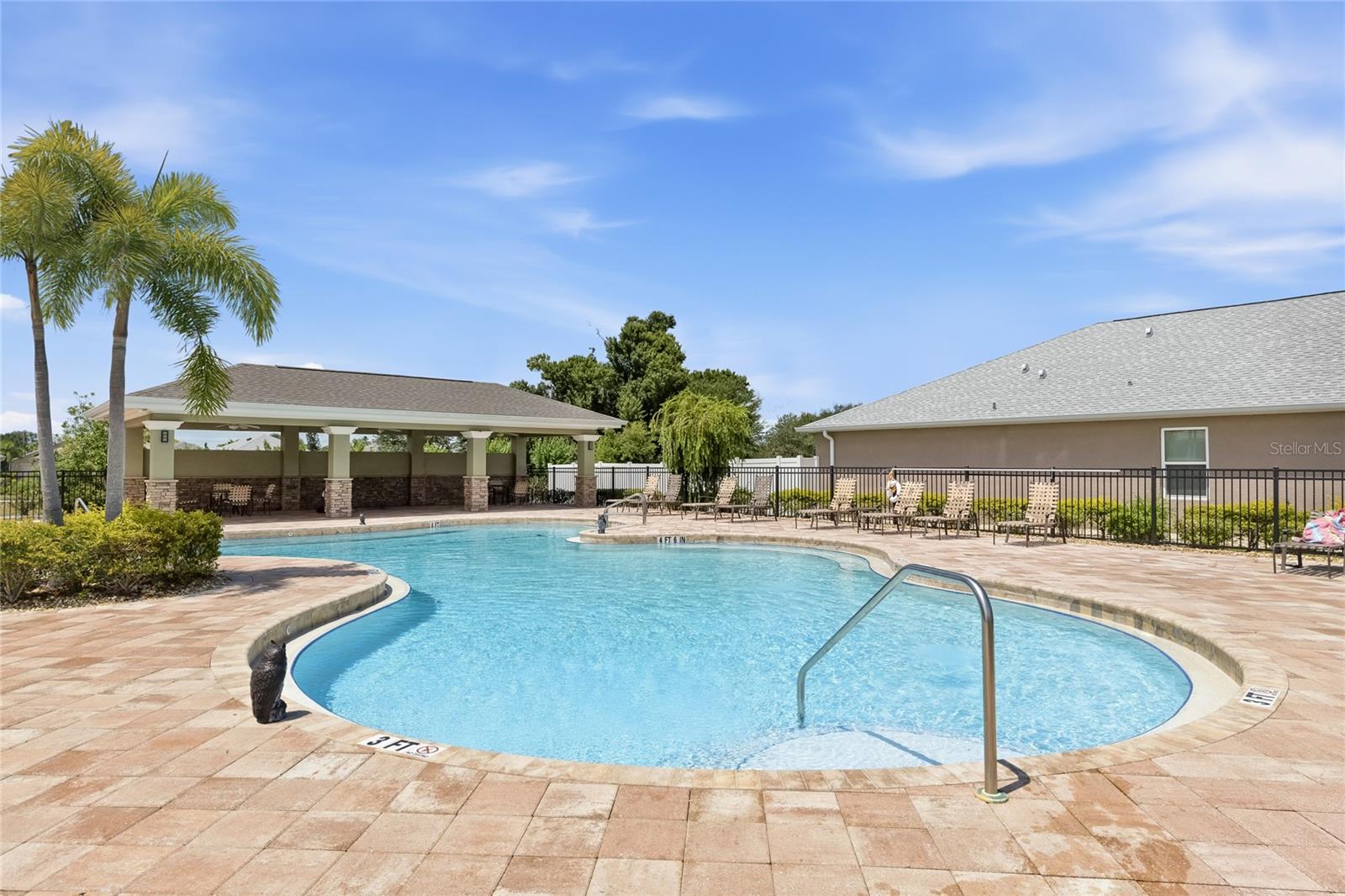 Large Community Pool with lounge chairs for sunbathing. Covered Pavilion with outdoor tables and chairs to enjoy lunch, dinner or a snack while getting out of the sun. Restrooms available as well. - 24413 BANDONI PL, VENICE