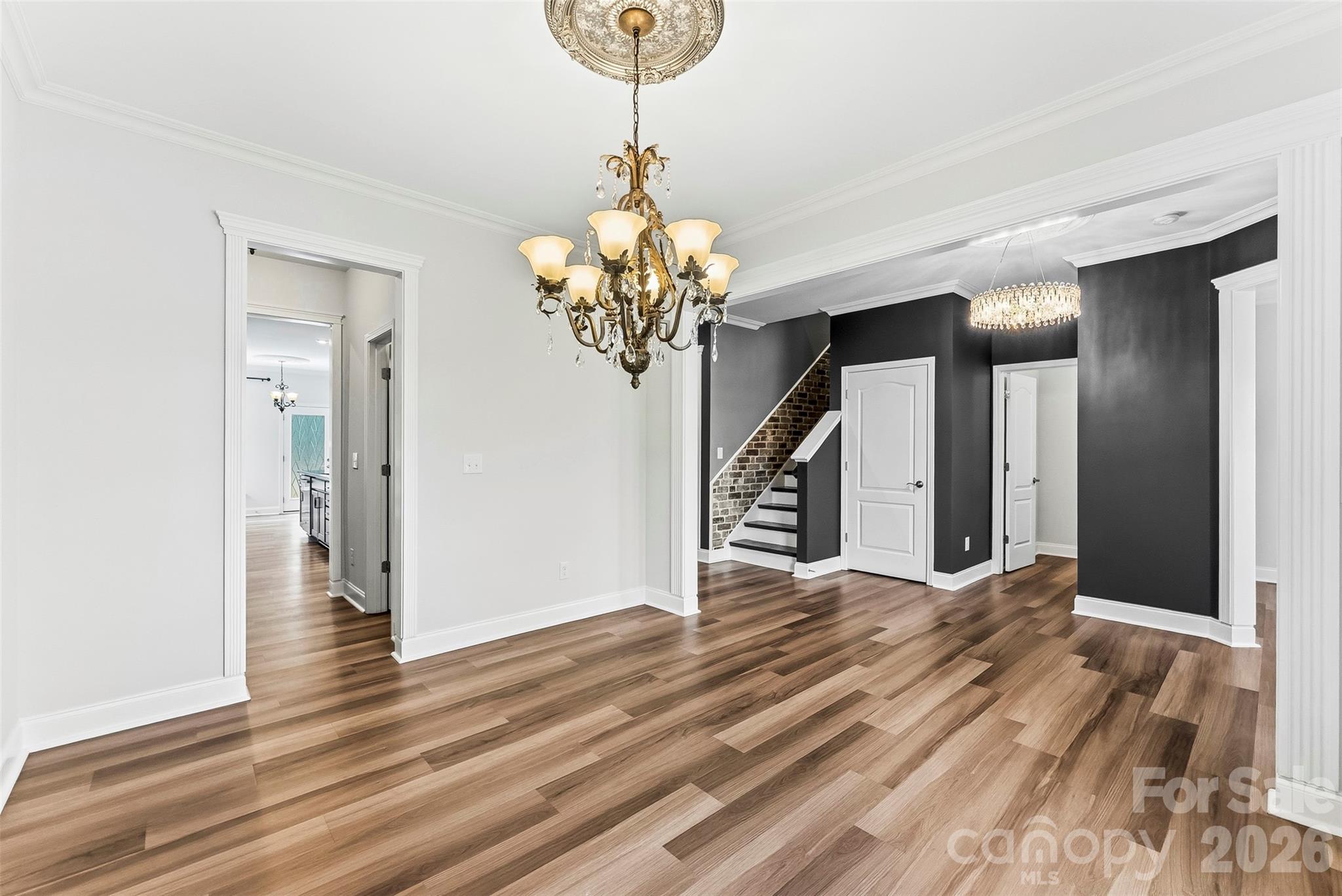 Another view of the well appointed Dining Room which can be a flex room as well. Freshly painted, upgraded lighting and beautiful flooring. - 1318 Poppy Way, Matthews
