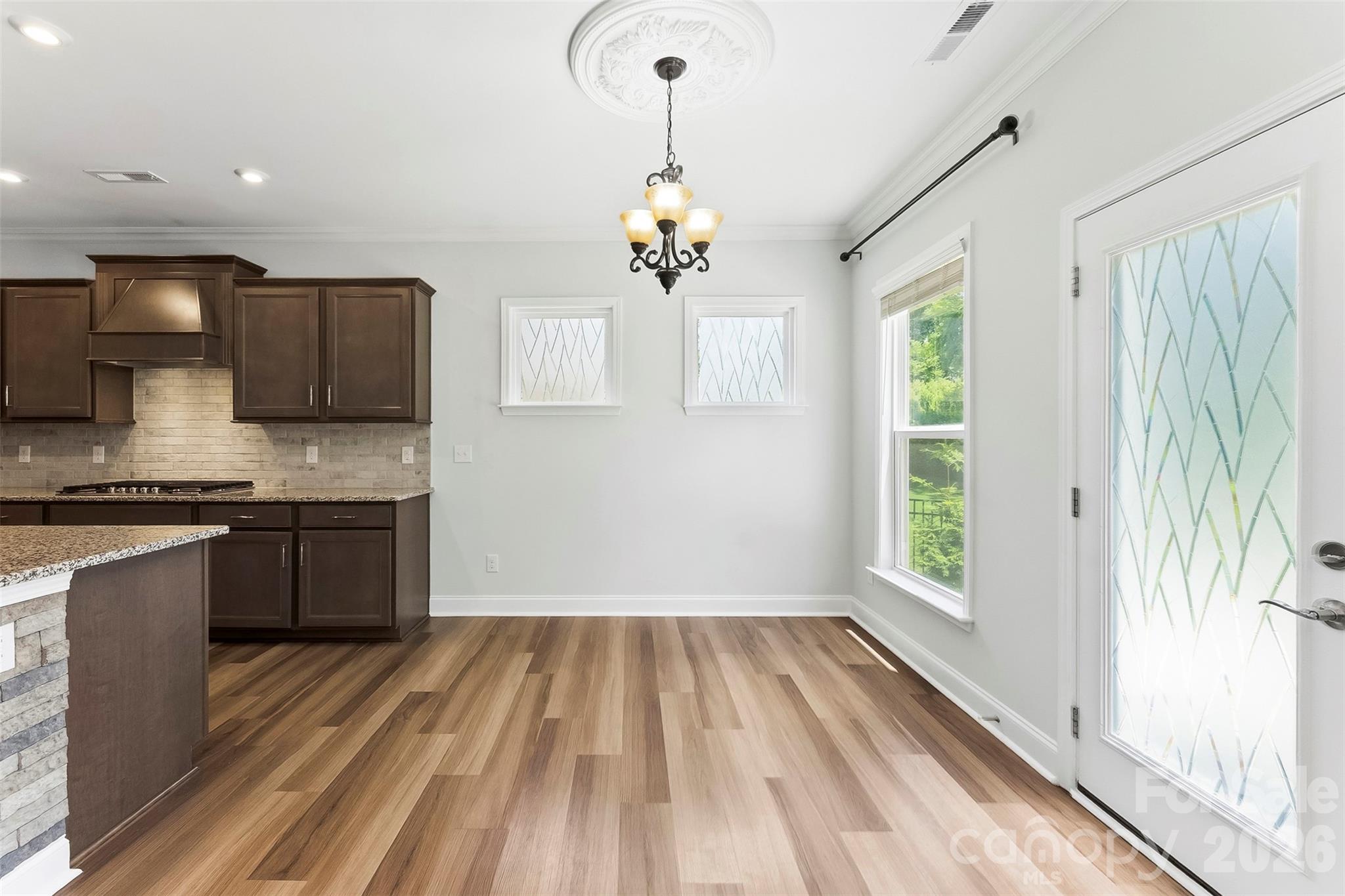 Breakfast Room. Freshly Painted, lots of natural lighting, gorgeous flooring and upgraded lighting. - 1318 Poppy Way, Matthews