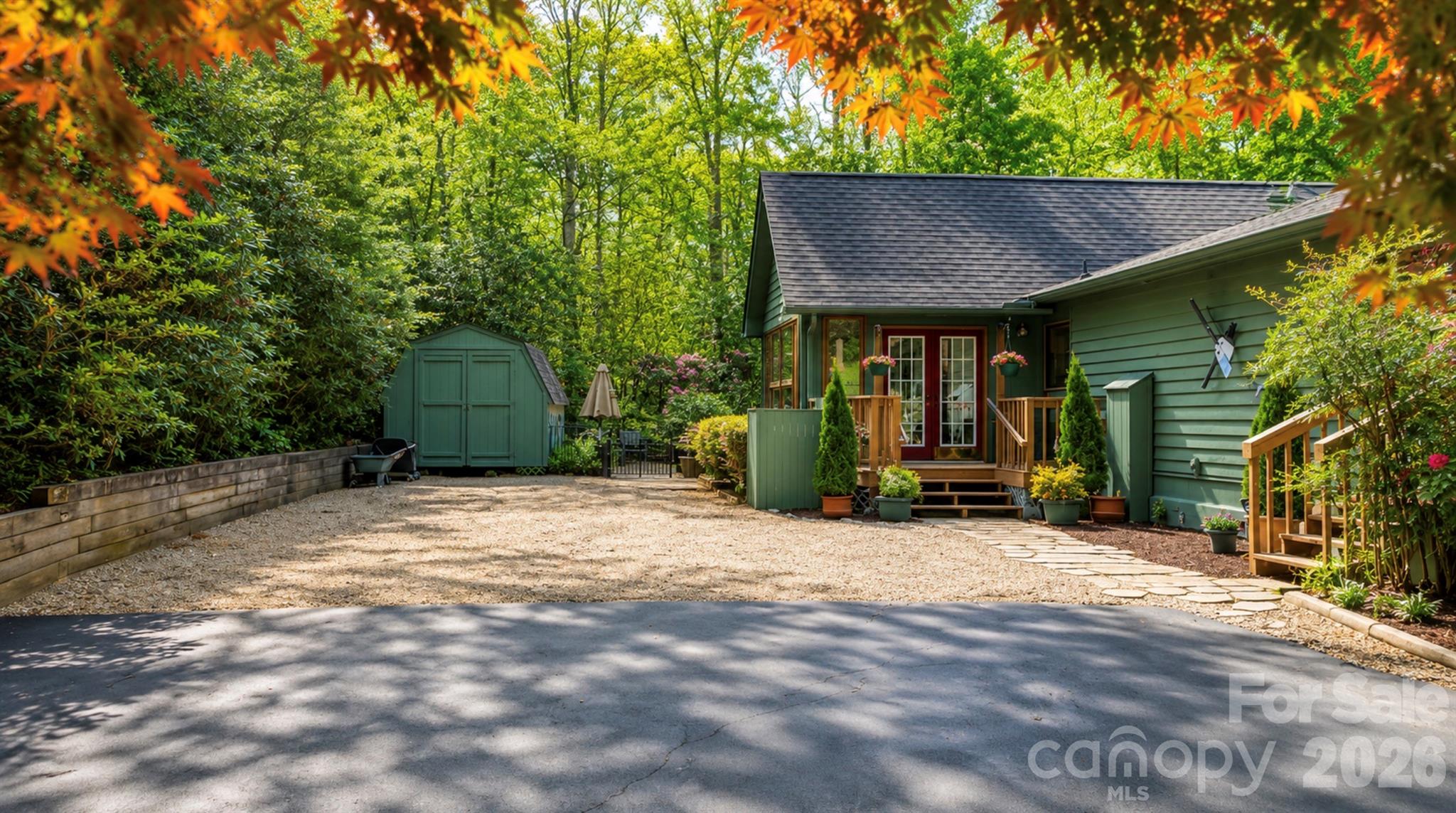 The large, level parking area leads directly to the backyard oasis, or the all season sunroom - 2698 Connestee Trail, Brevard