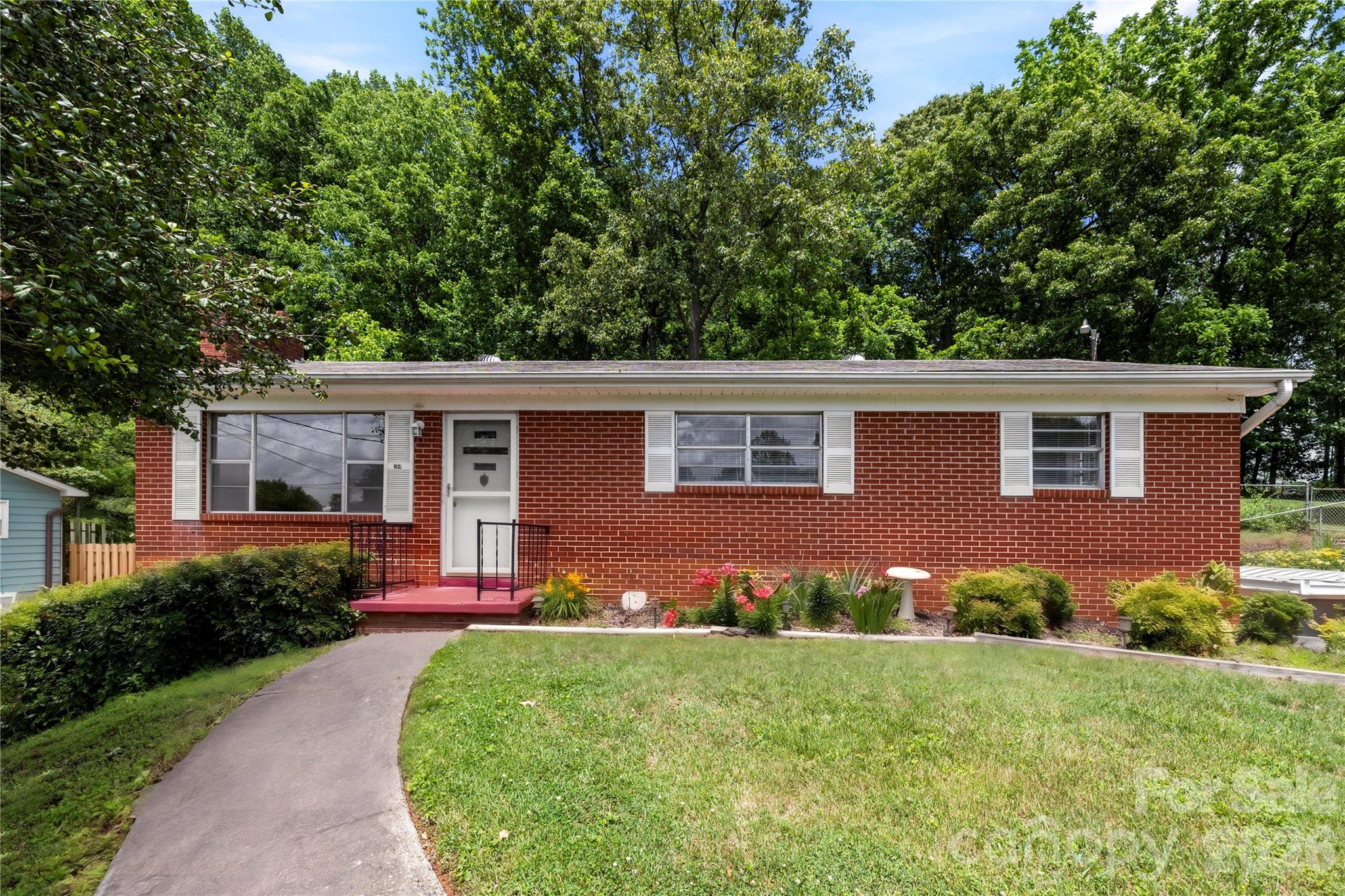 Single Family Residence at 309 Oak Hill Road, Candler, photo 2 of 41