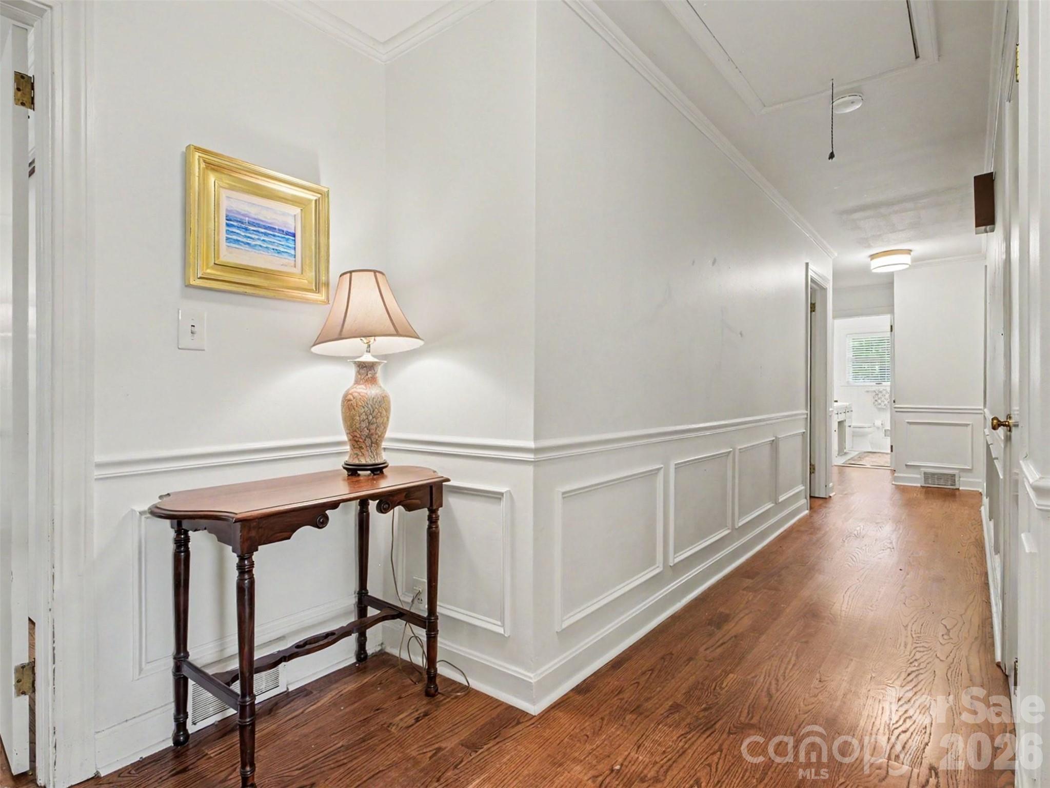 A wide hallway that leads to rest: three bedrooms, two full baths - 441 Claymont Street SE, Concord
