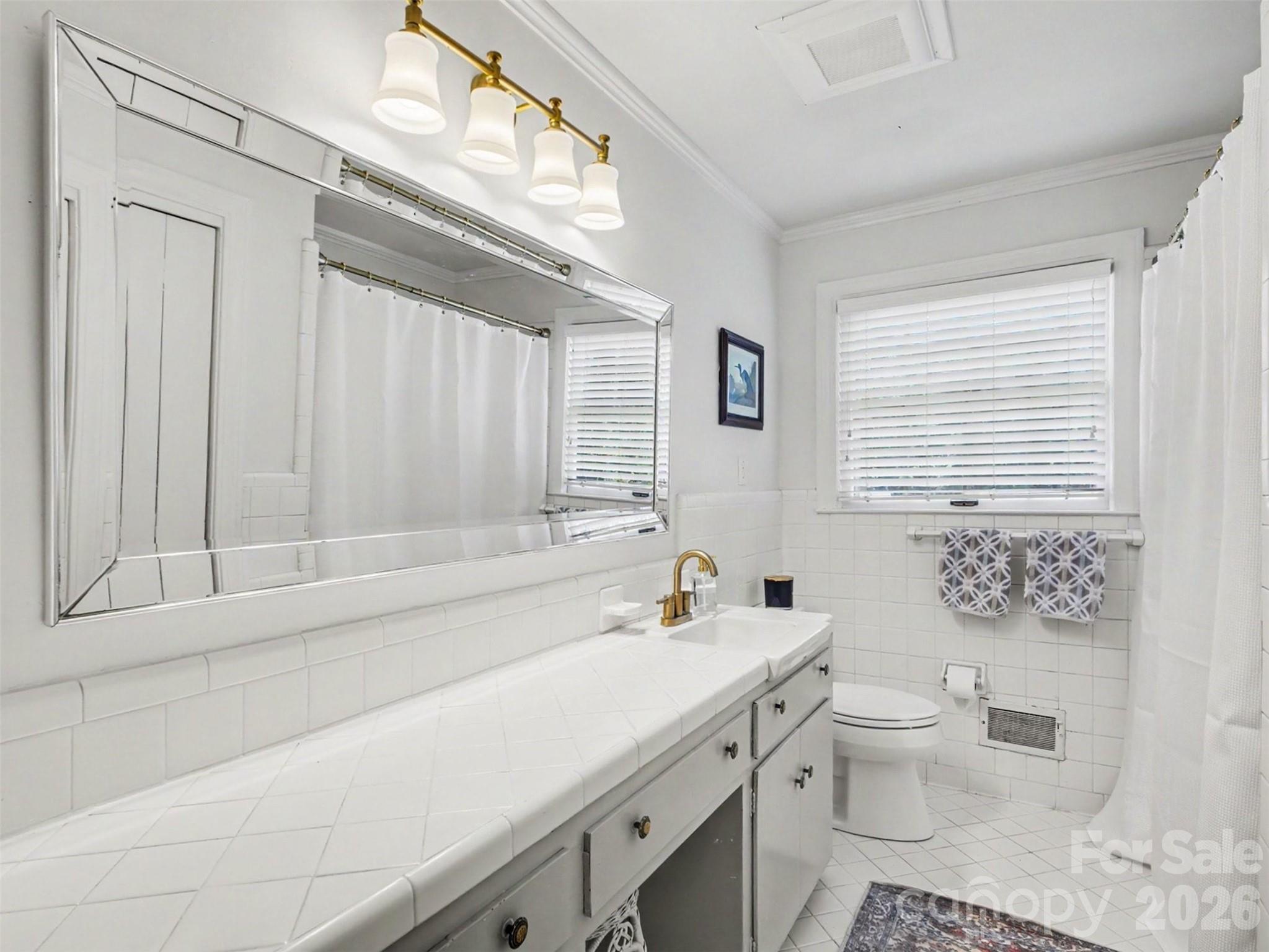 A hall bath with all its original charm intact - 441 Claymont Street SE, Concord