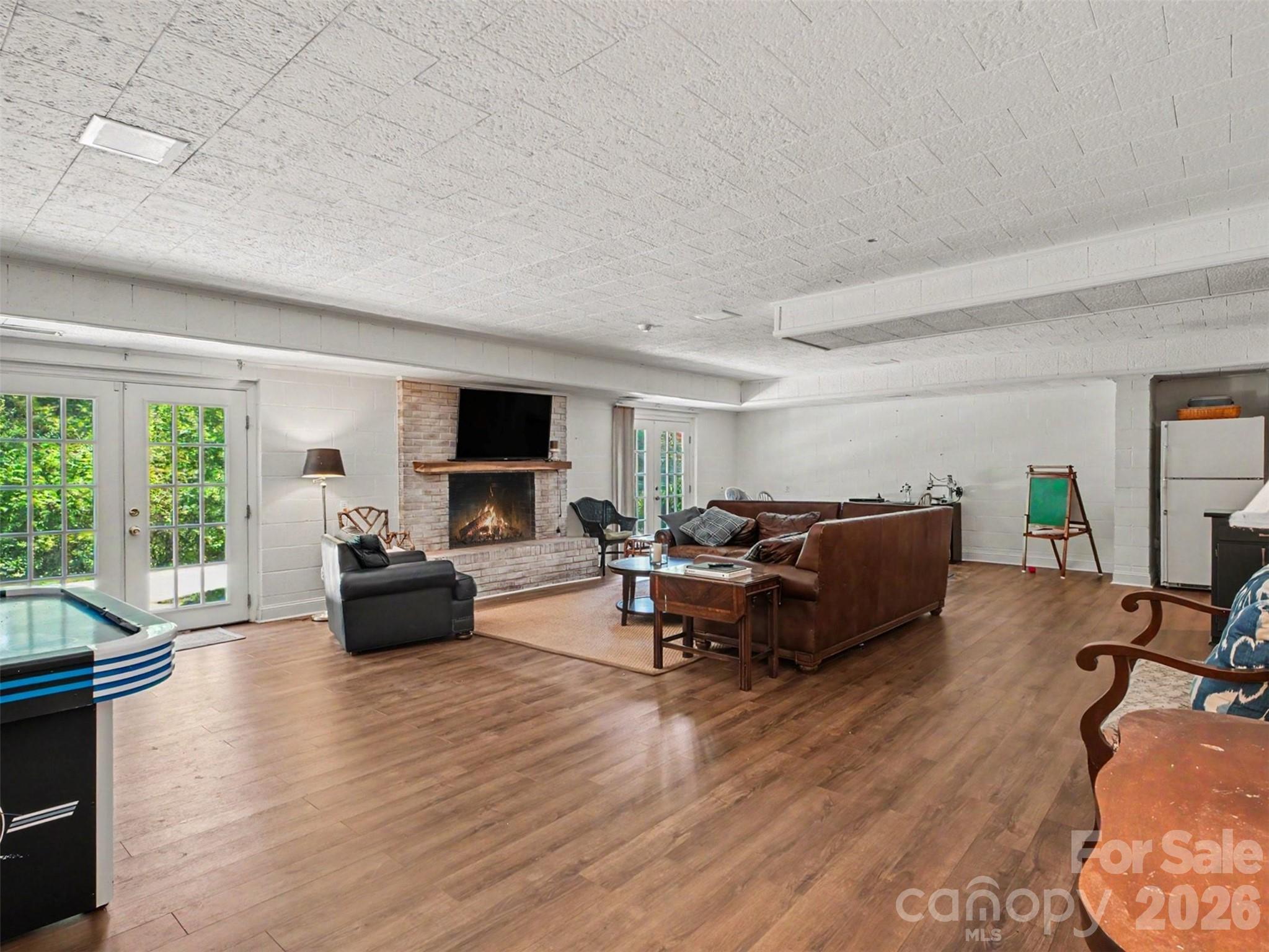 The basement living room: space to spread out and settle in - 441 Claymont Street SE, Concord