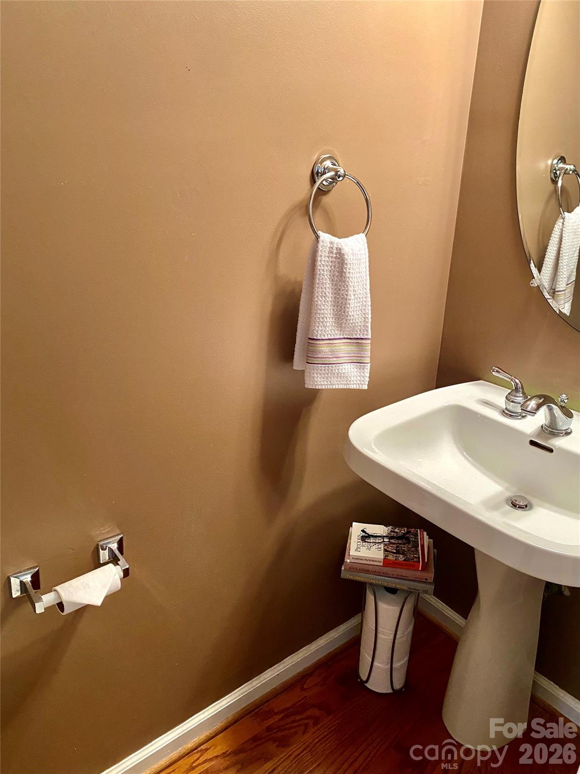 Half Bath on first floor with pedestal sink. - 6025 Creft Circle, Indian Trail