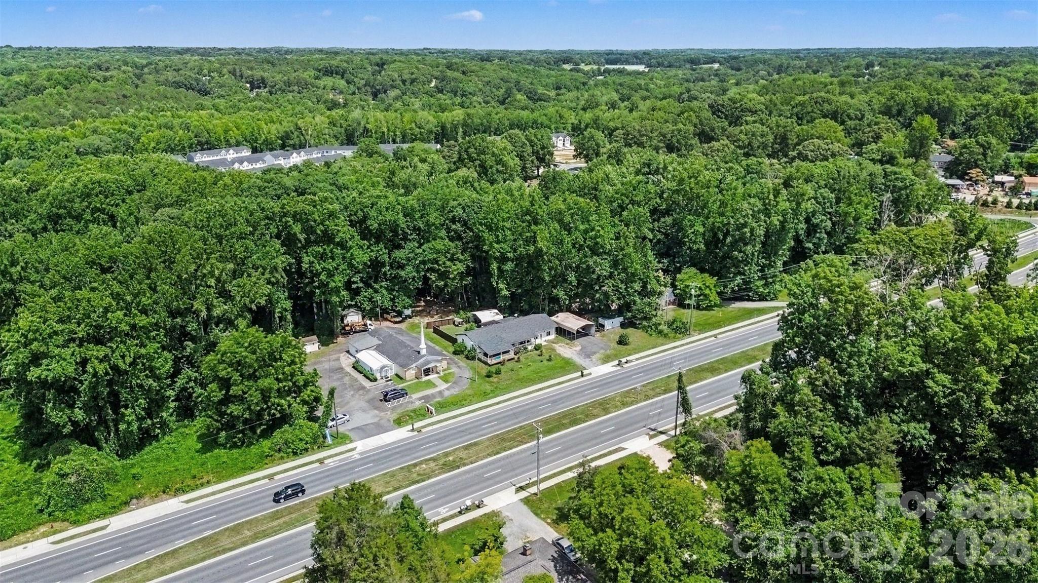 Surrounded by mature tree canopy in the heart of Kannapolis - 1306 Mooresville Road, Kannapolis