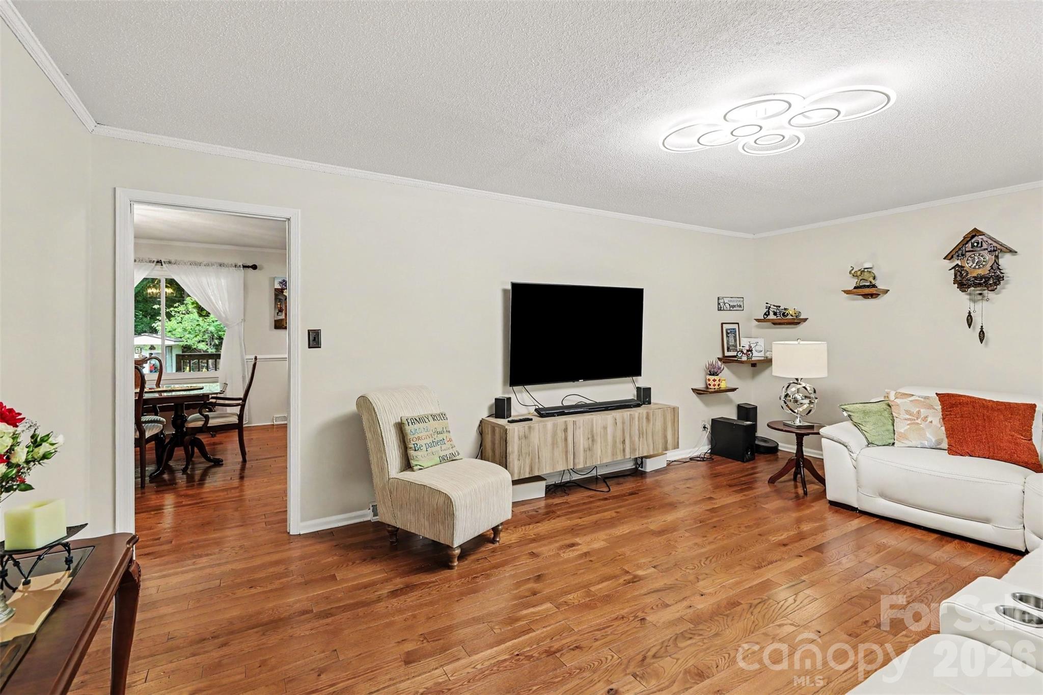 Living room flows into the dining room, hardwood floors throughout - 1306 Mooresville Road, Kannapolis
