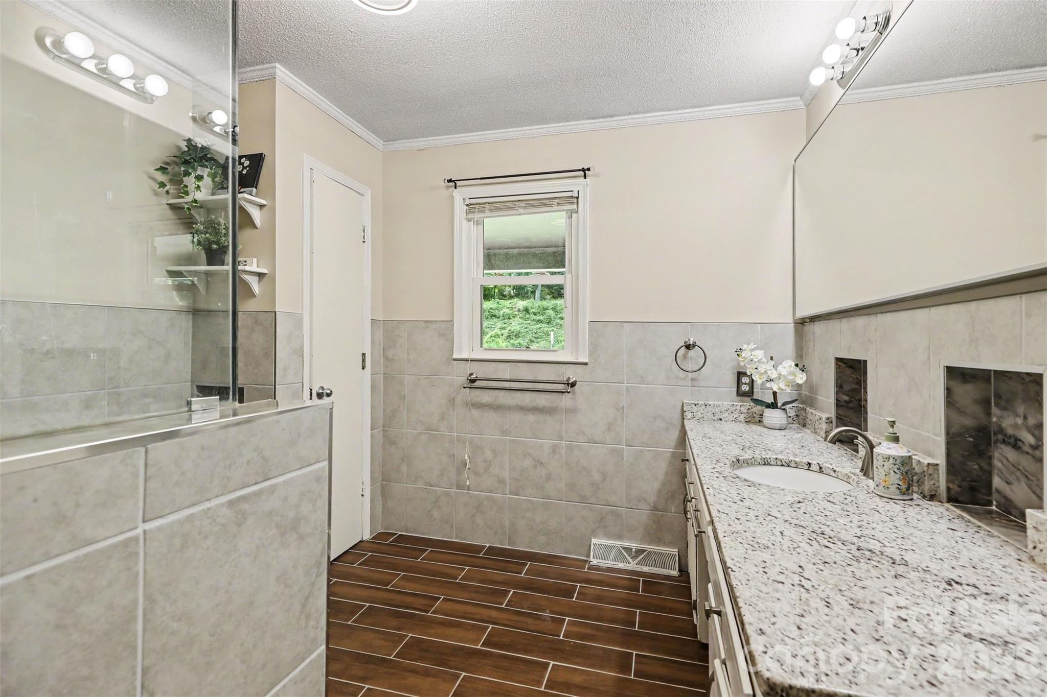 Updated bathroom with granite vanity and walk-in shower - 1306 Mooresville Road, Kannapolis