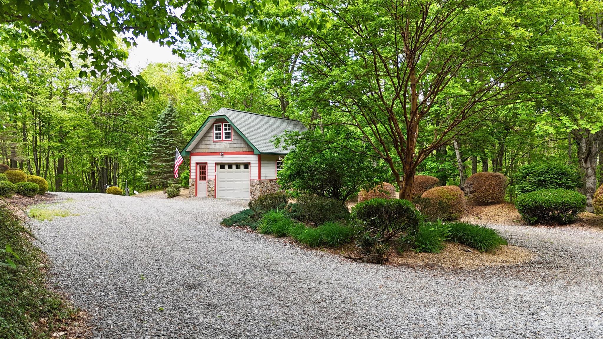 Ample parking in the circular driveway, with the detached garage shown at the end. - 905 Old Fiddle Road, Waynesville