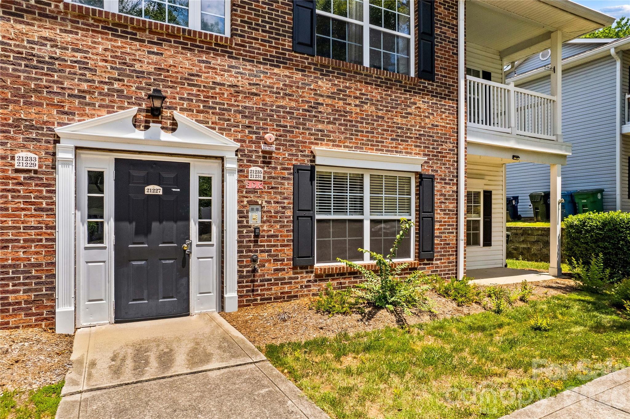 Main floor condo with covered porch. - 21231 Hickory Street, Cornelius