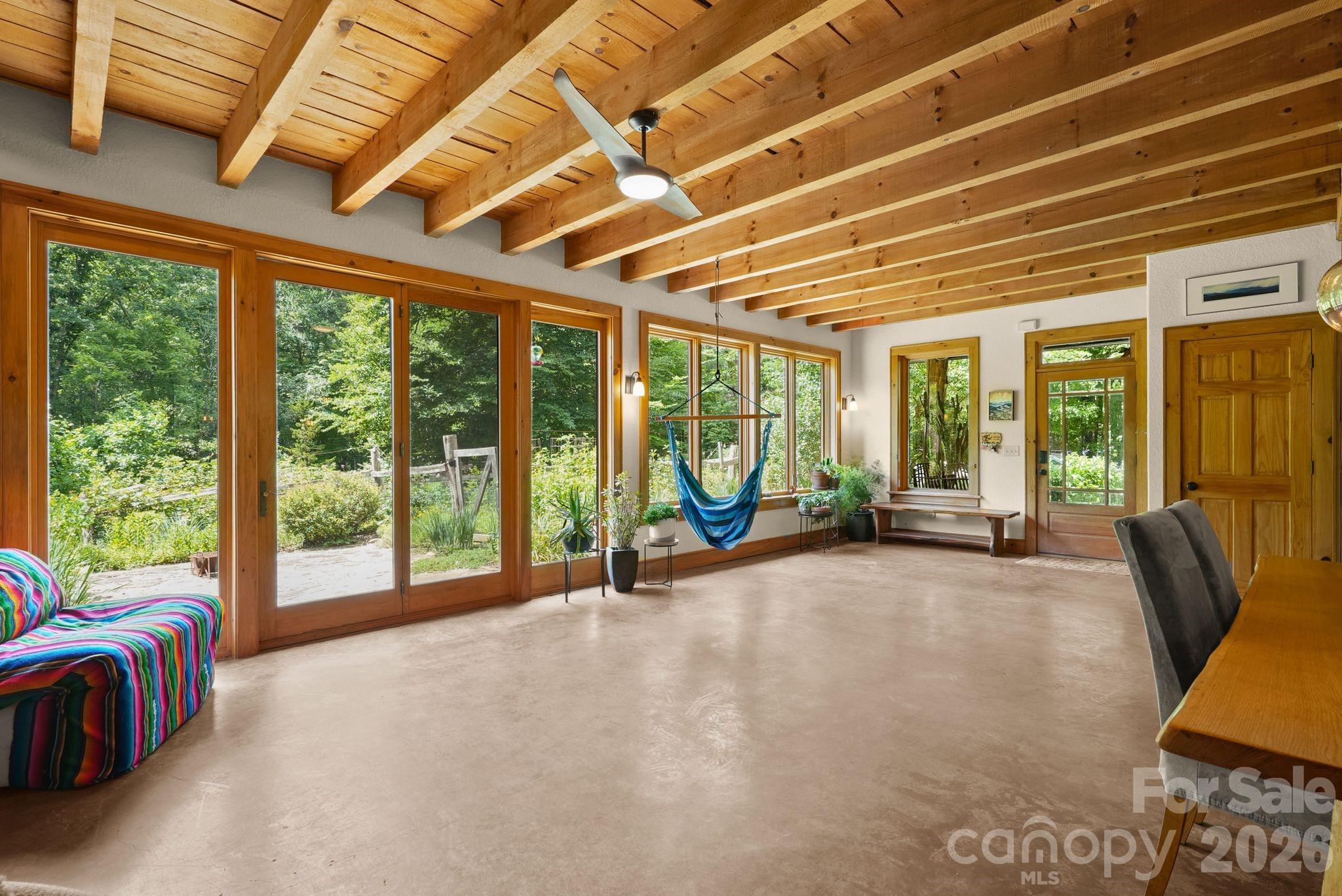 living room overlooks organic gardens - 24 Merriwood Trail, Arden