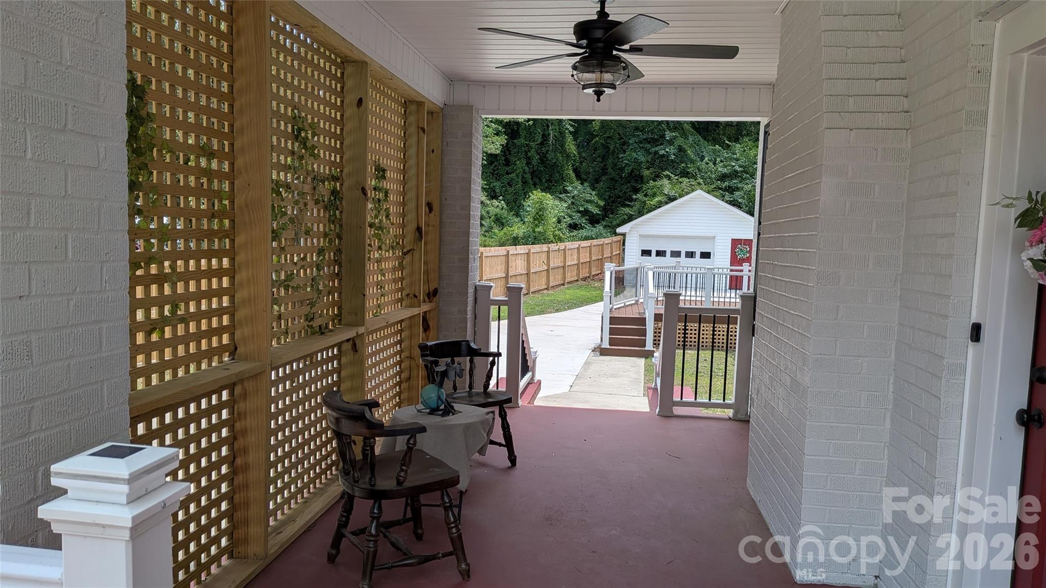 Front porch, actually staged, wraps around to the side allowing for another conversation area. The trellis permits a welcome breeze on warm days while providing privacy. Great view of the back, low maintenance deck, 1-car garage/workshop w/ new floor, roof and siding. Have a boat or RV? Plenty of parking in the back. The Moss Lake boat ramp is about 15 min. from this property The Shelby Recreation Center & Park is just 1/2 mile from the house. - 933 W Warren Street, Shelby