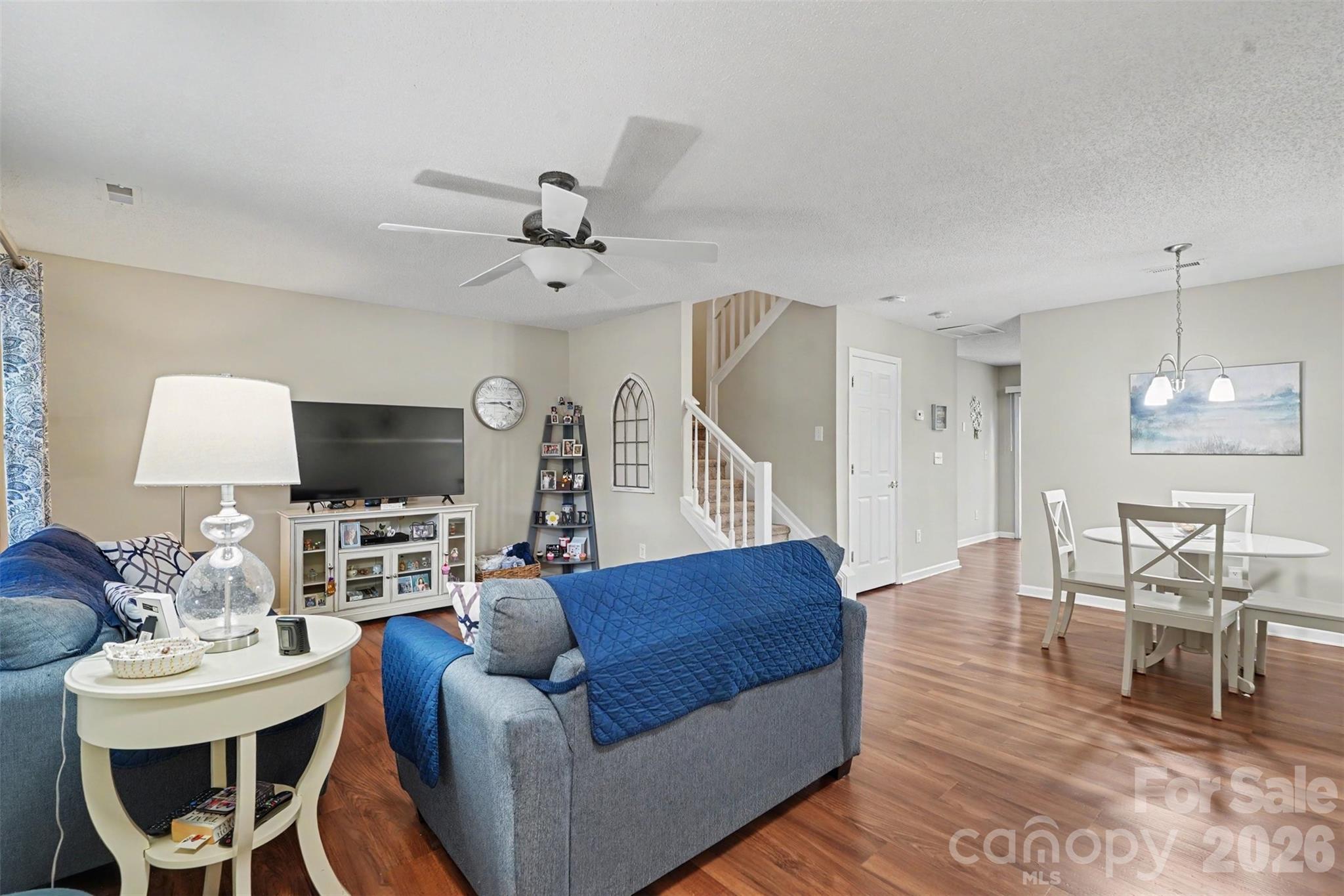 Open living + dining room with LVP - 605 Gelderland Drive, Matthews