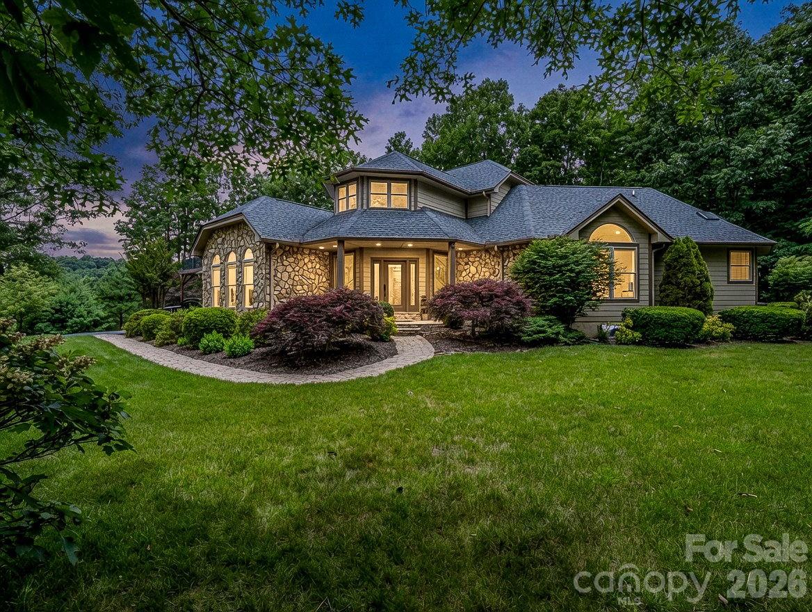 Private mountain estate with beautiful mature landscaping and a level yard is hard to find. - 131 Arcadia Falls Way, Black Mountain