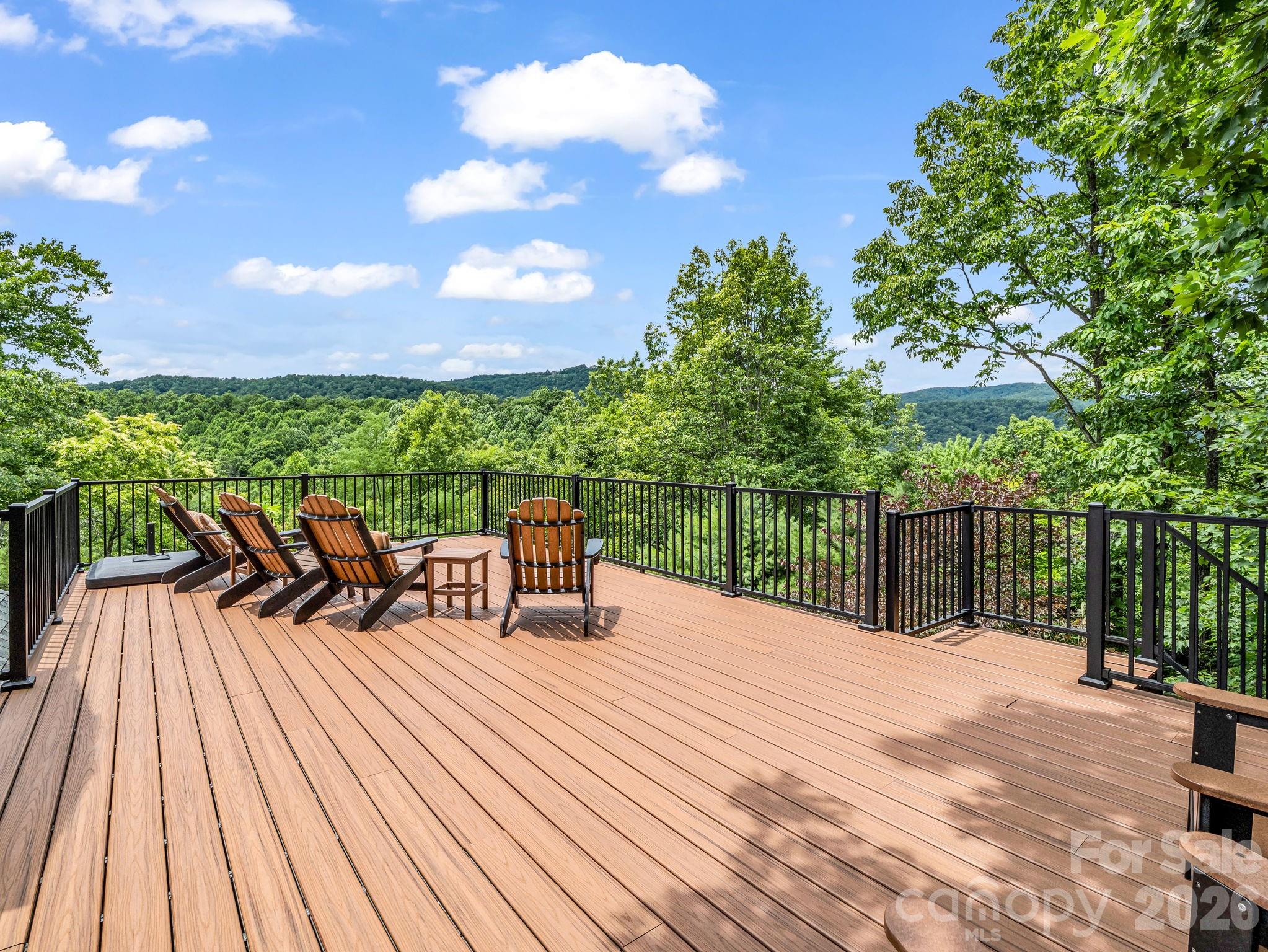 Observatory deck with views to Mt. Mitchell. The tallest peak east of the Mississippi. Large shade umbrella makes this the perfect spot any time of day. Enjoy the relaxing cool mountain temperatures. - 131 Arcadia Falls Way, Black Mountain