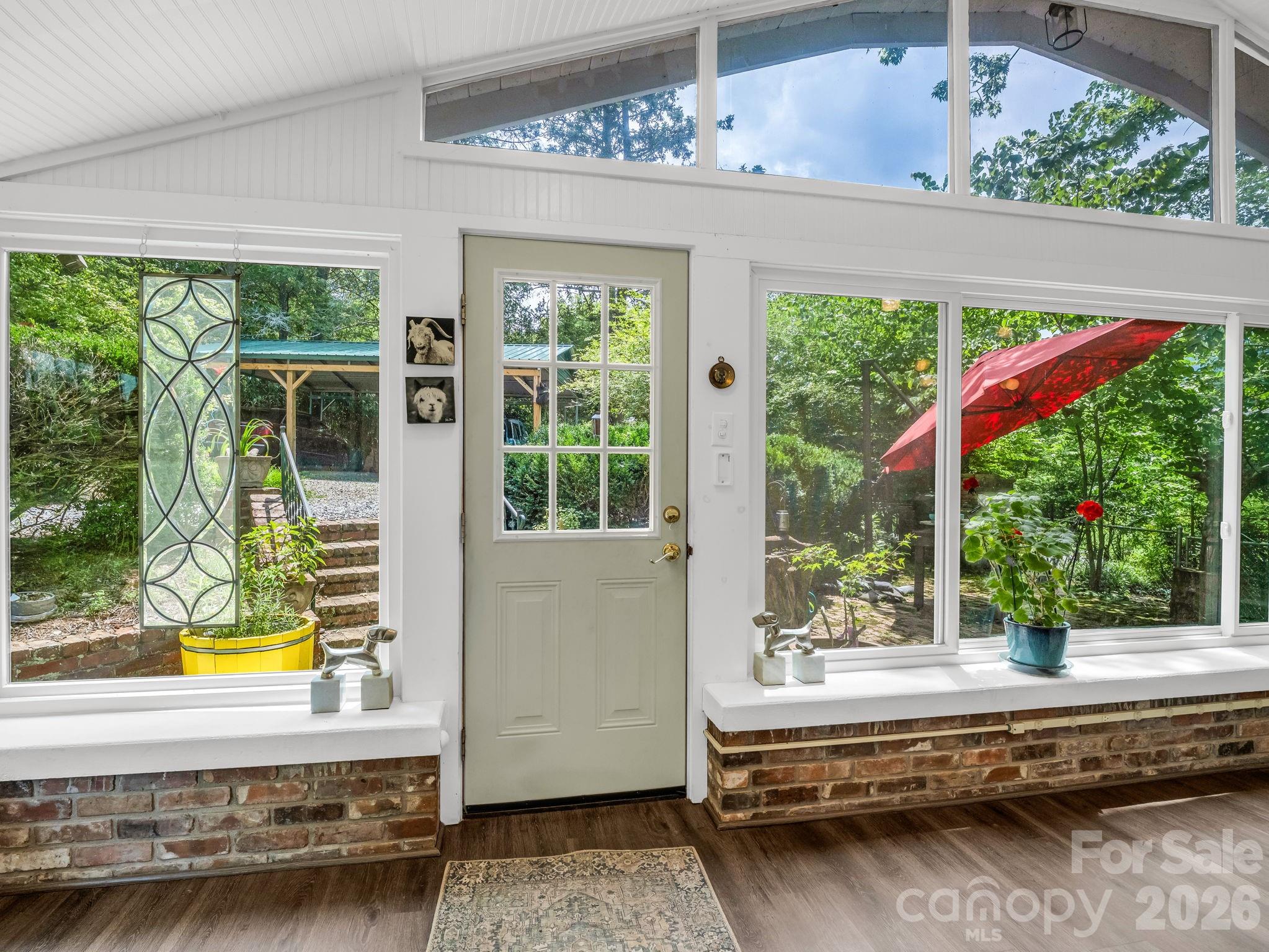 Enjoy the outdoors from this sunroom with abundant natural light. - 23 Sunset Drive, Black Mountain