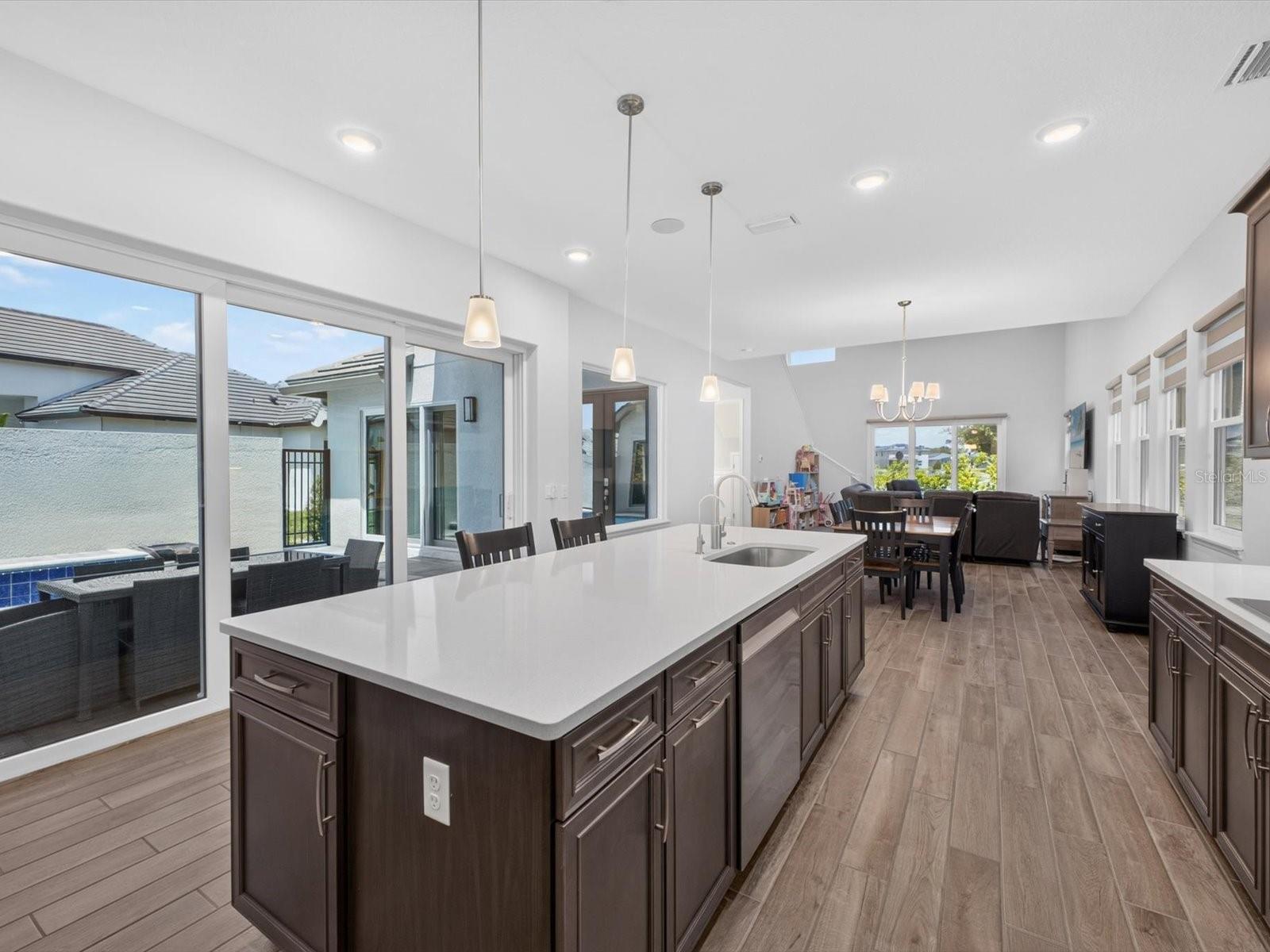 Dining and kitchen open to pool area - 196 HAMPTON LOOP, DAVENPORT